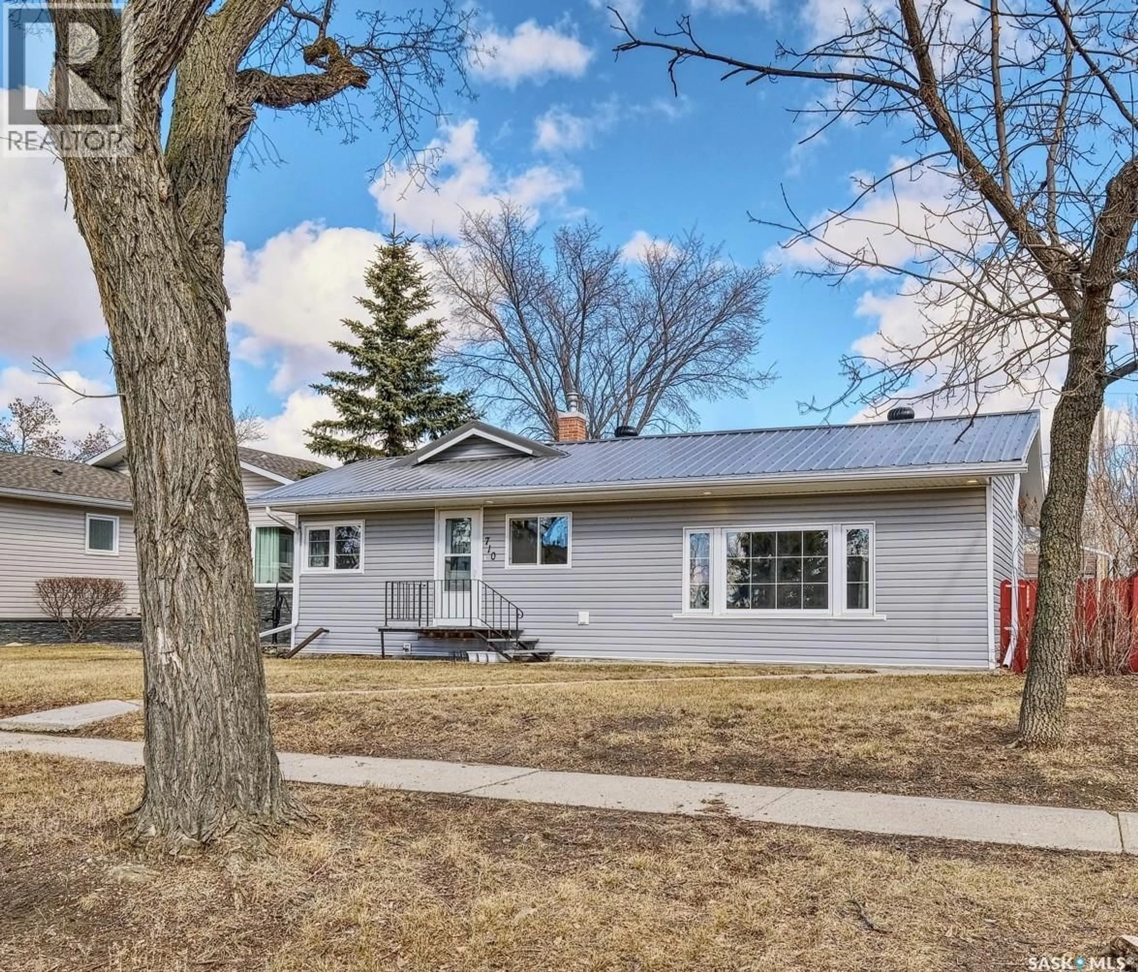 Home with vinyl exterior material, street for 710 MAIN STREET, Rosetown Saskatchewan S0L2V0