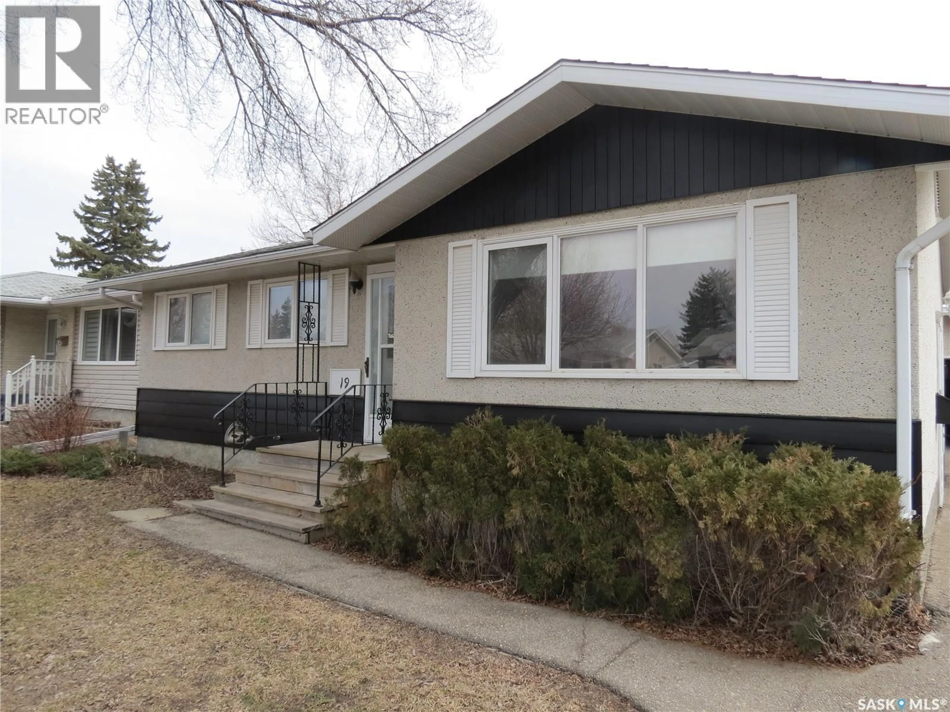 Home with vinyl exterior material, street for 19 MERLIN CRESCENT, Regina Saskatchewan S4R3E7