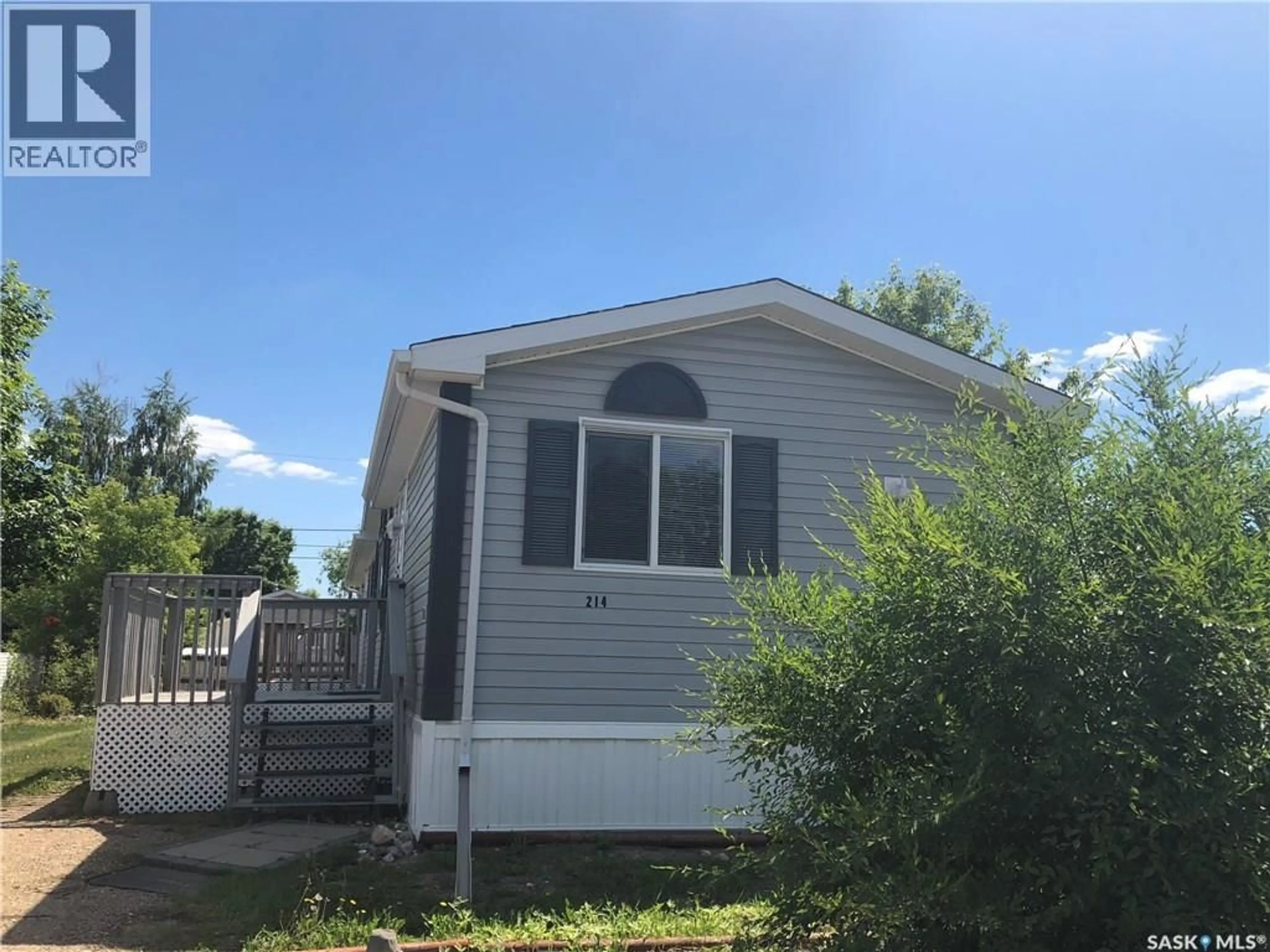 Home with vinyl exterior material, street for 214 14TH STREET, Humboldt Saskatchewan S0K2A0