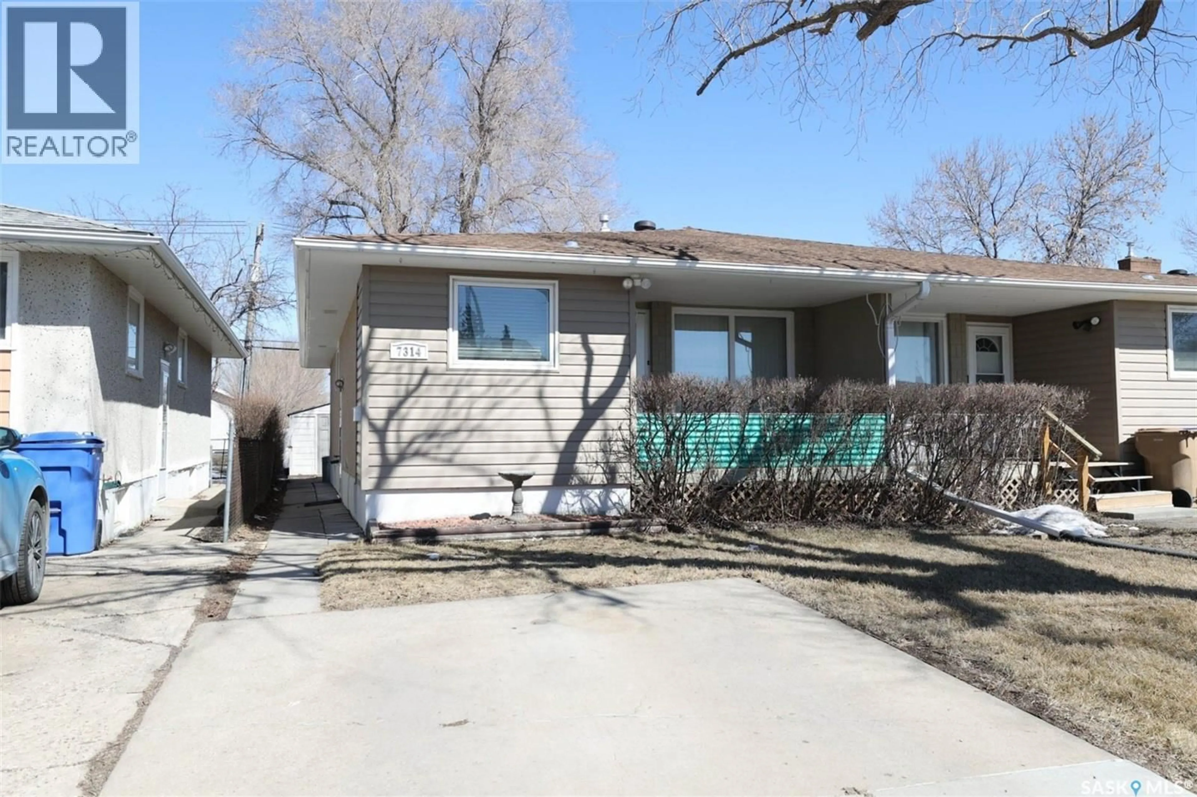 Home with vinyl exterior material, street for 7314 BOWMAN AVENUE, Regina Saskatchewan S4T6K8
