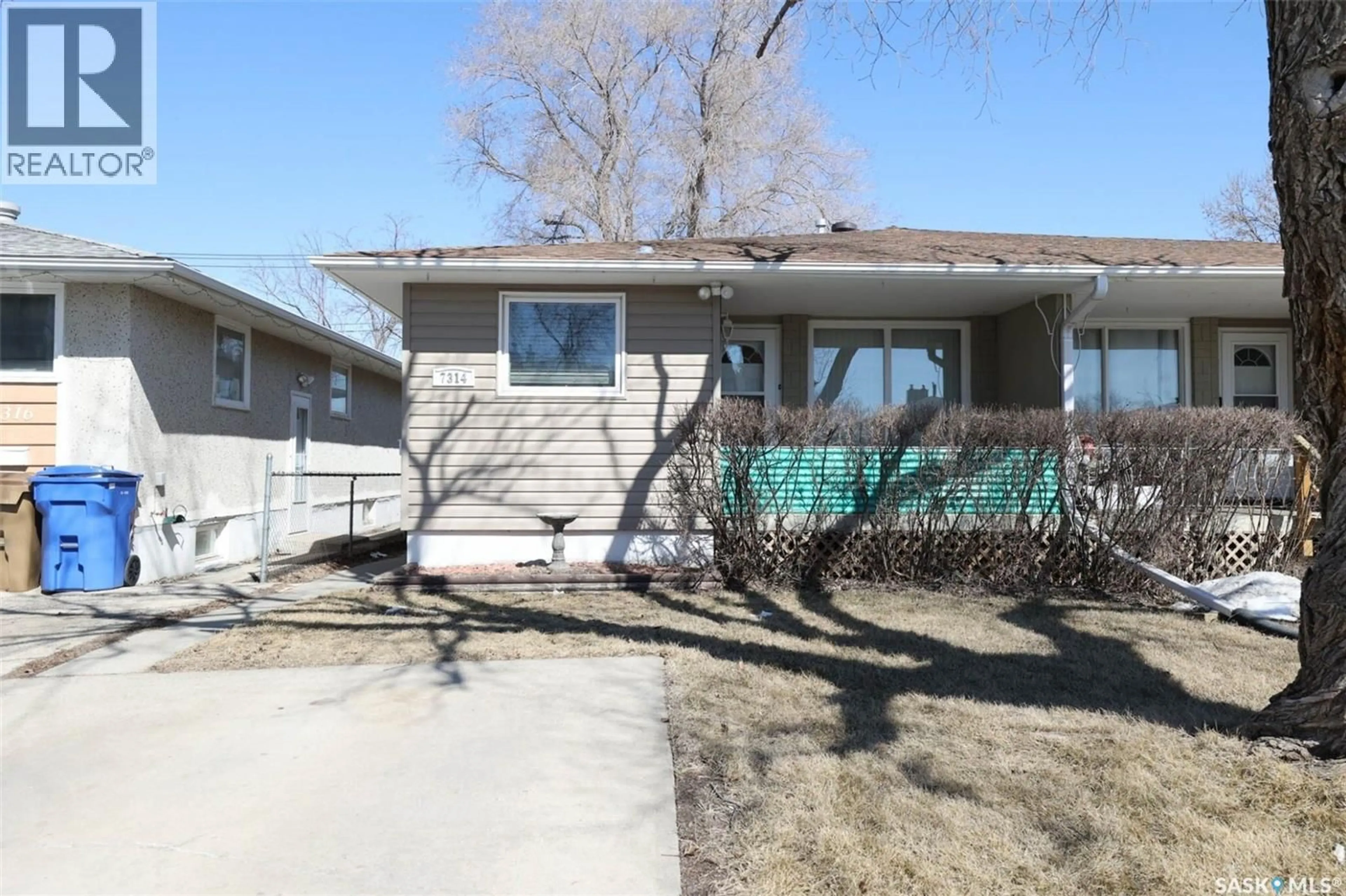 Home with vinyl exterior material, street for 7314 BOWMAN AVENUE, Regina Saskatchewan S4T6K8