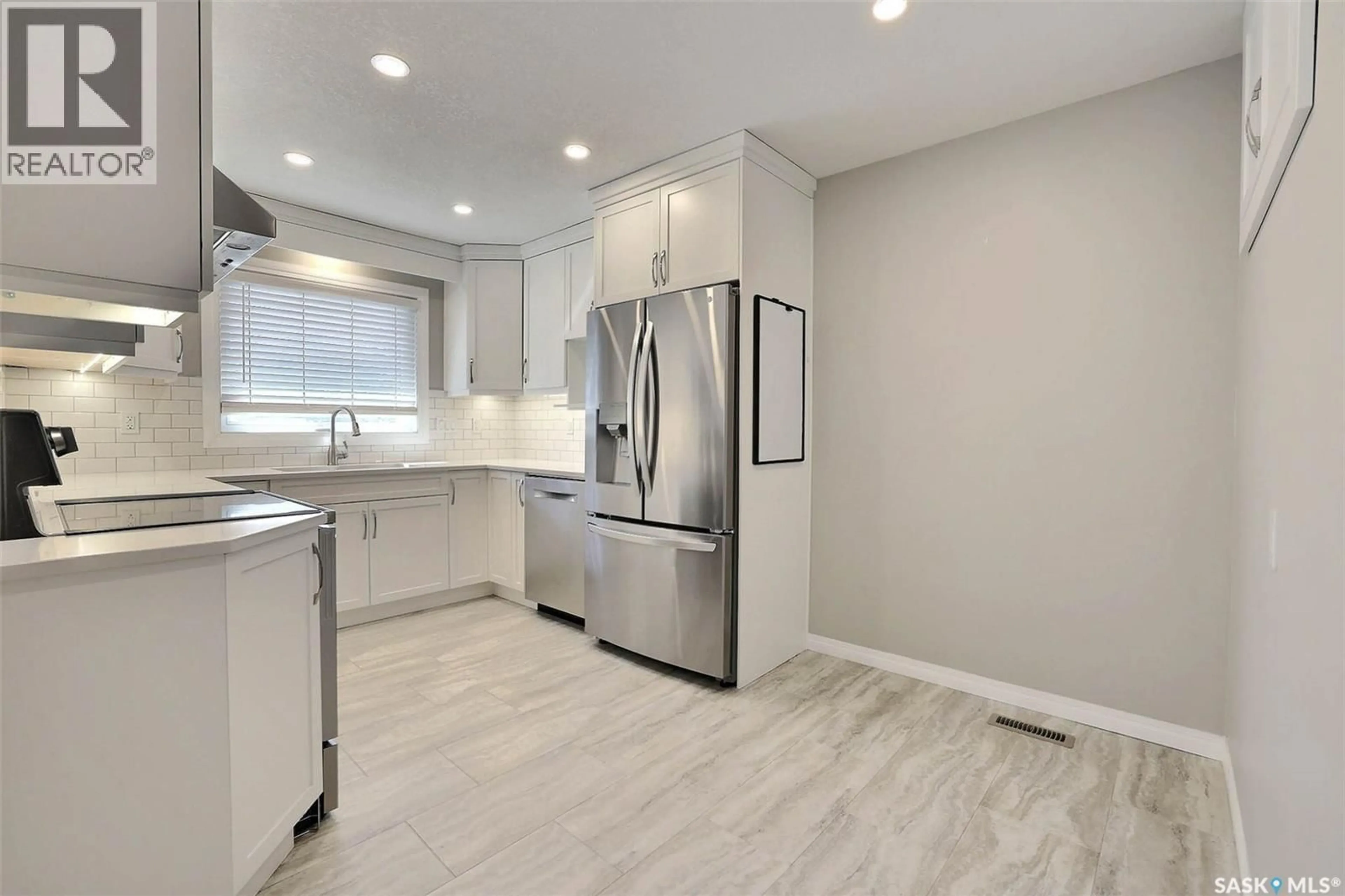 Open concept kitchen, ceramic/tile floor for 7314 BOWMAN AVENUE, Regina Saskatchewan S4T6K8