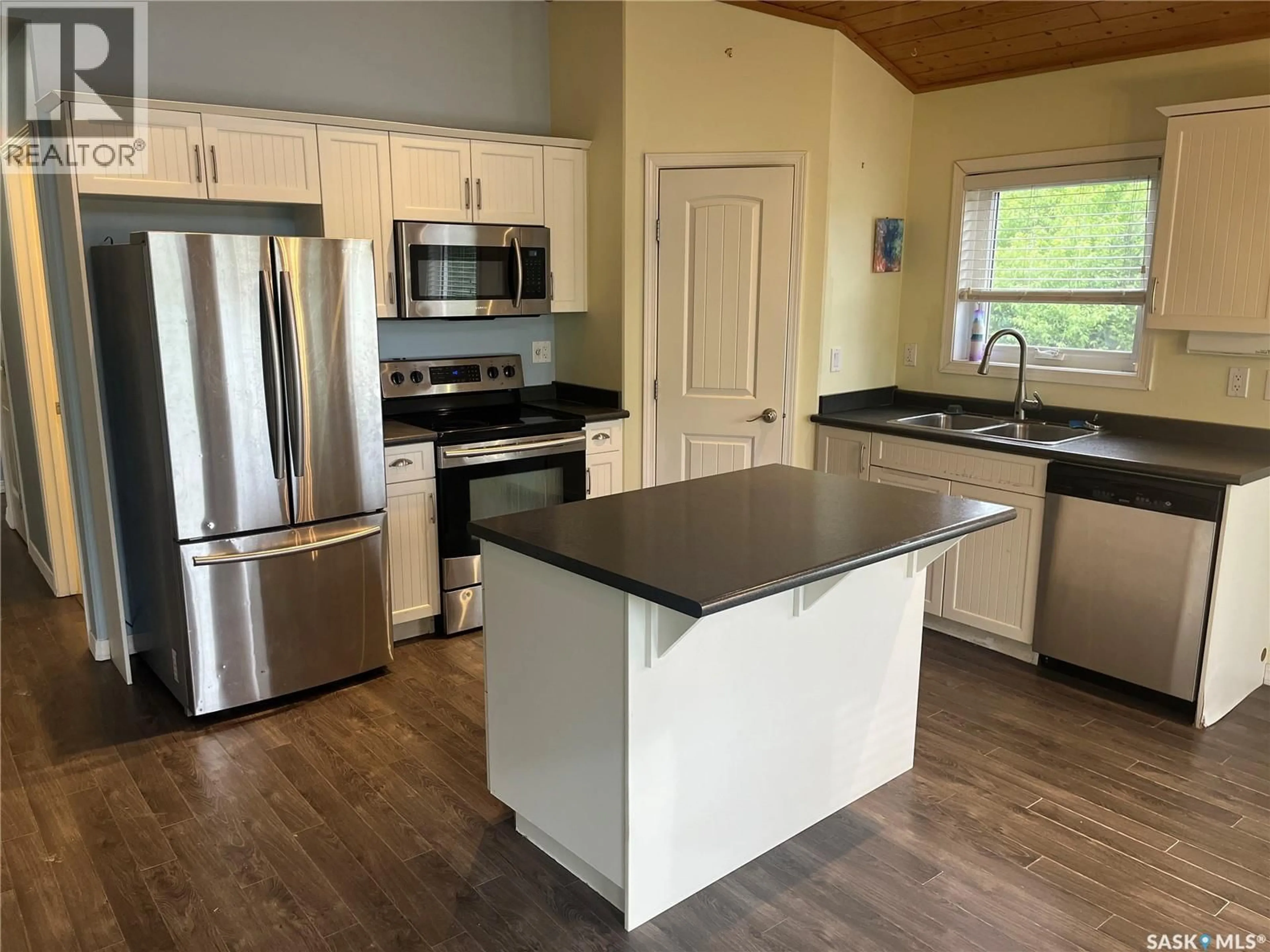 Open concept kitchen, wood/laminate floor for 9 TRANQUILITY PLACE, Big River Rm No. 555 Saskatchewan S0J0E0