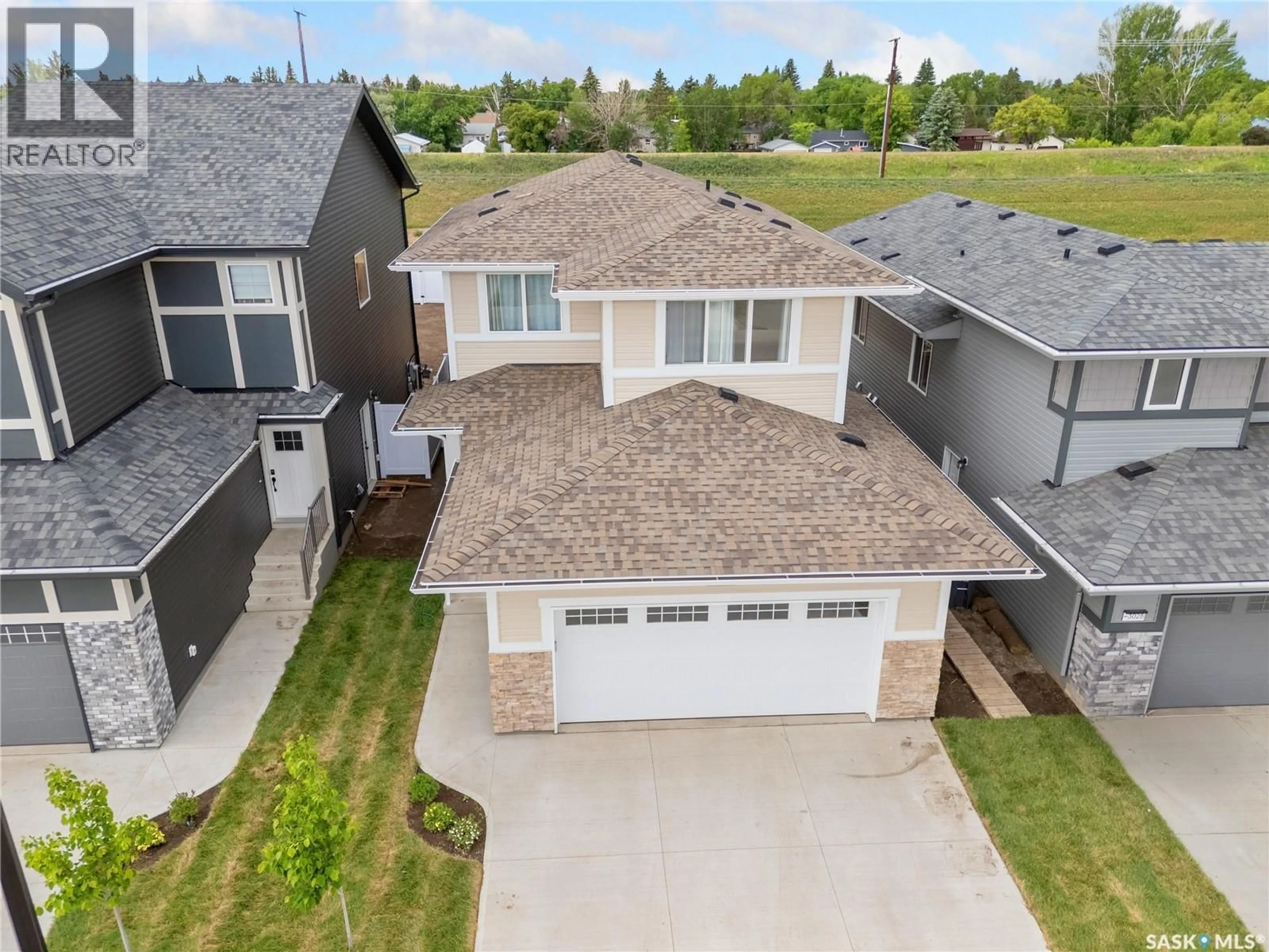 A pic from outside/outdoor area/front of a property/back of a property/a pic from drone, street for 304 PEPPER PLACE, Saskatoon Saskatchewan S7V1S7