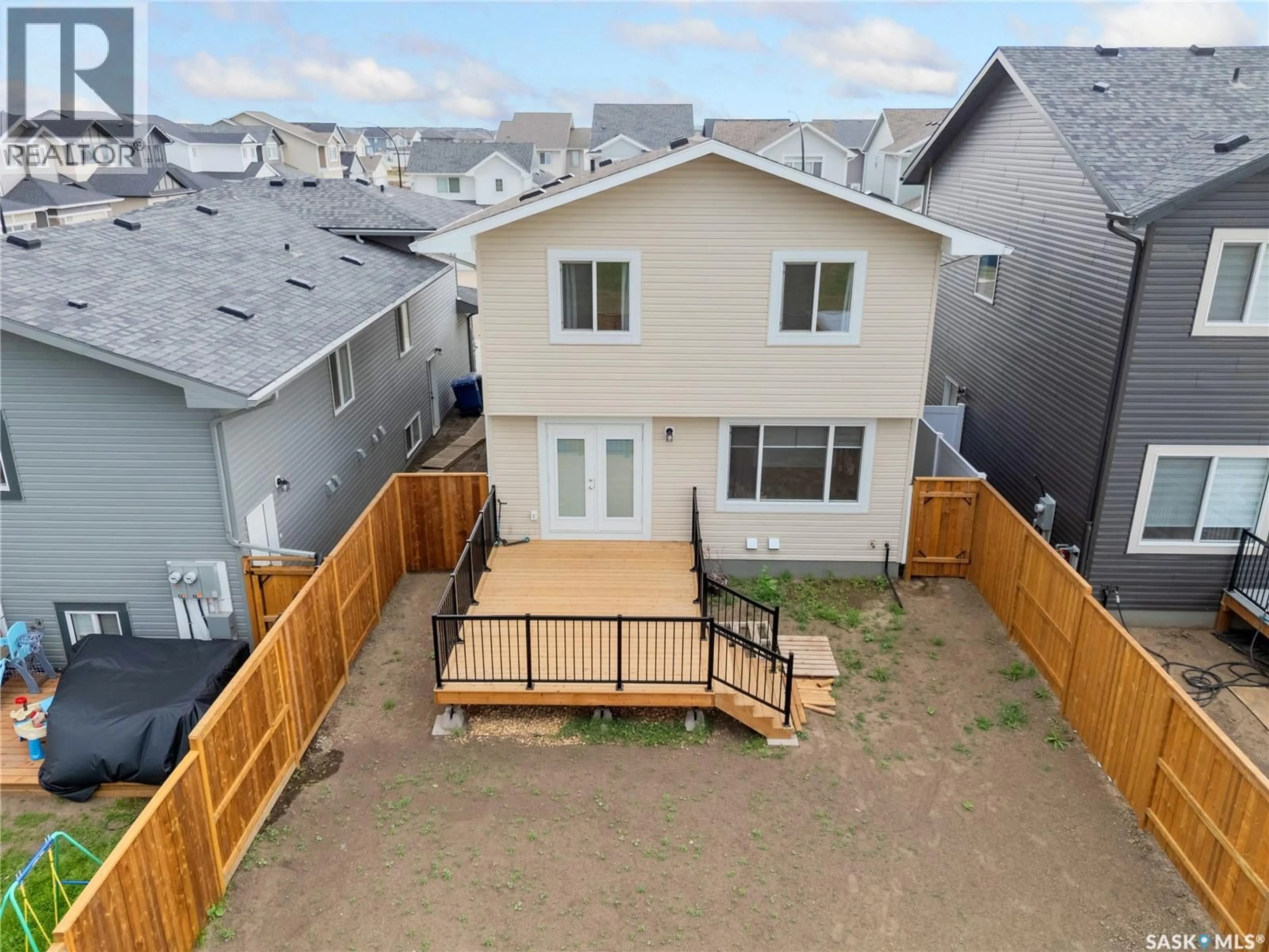 A pic from outside/outdoor area/front of a property/back of a property/a pic from drone, street for 304 PEPPER PLACE, Saskatoon Saskatchewan S7V1S7