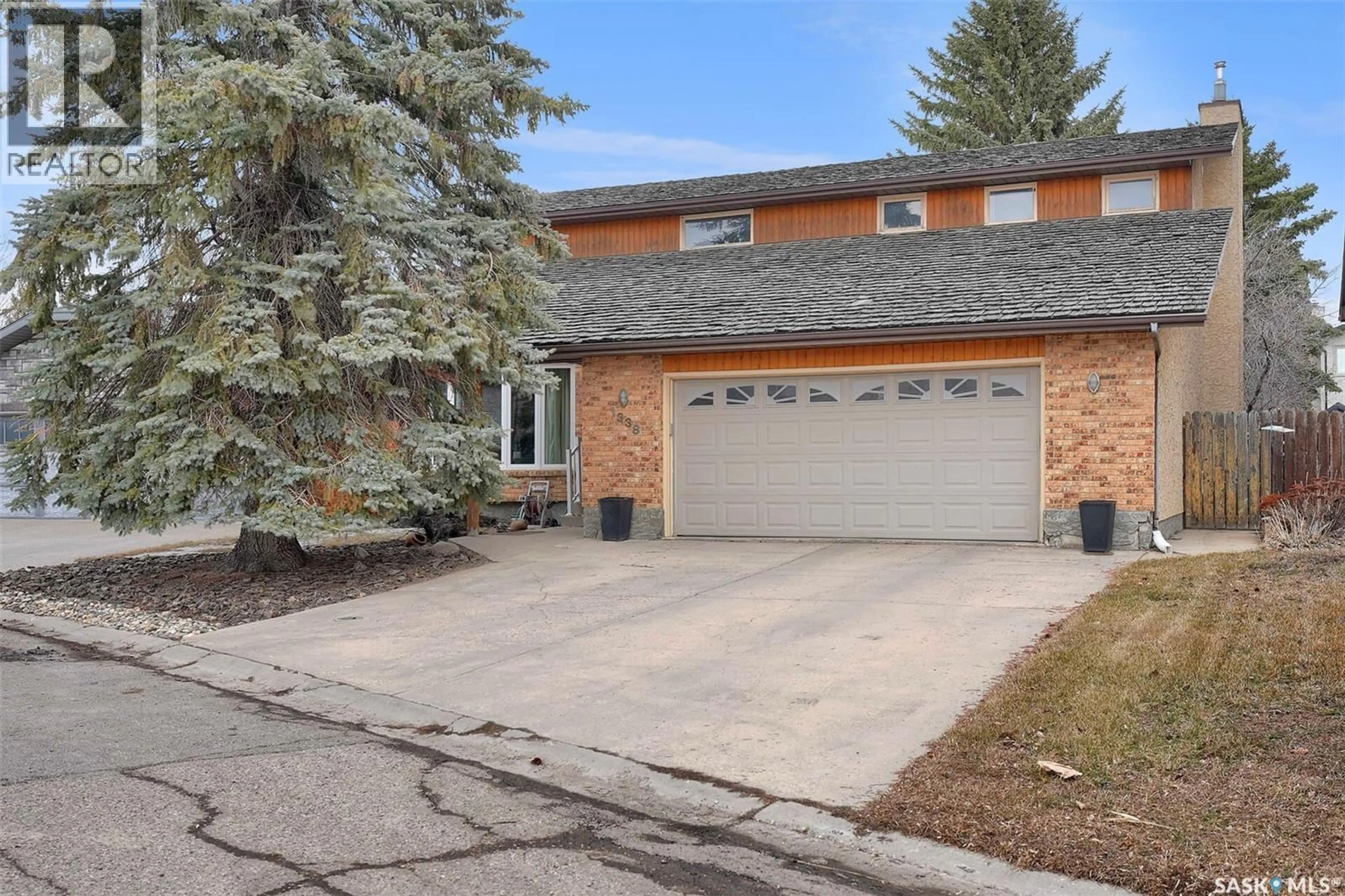 Home with brick exterior material, street for 1338 REED PLACE, Regina Saskatchewan S4X3G6