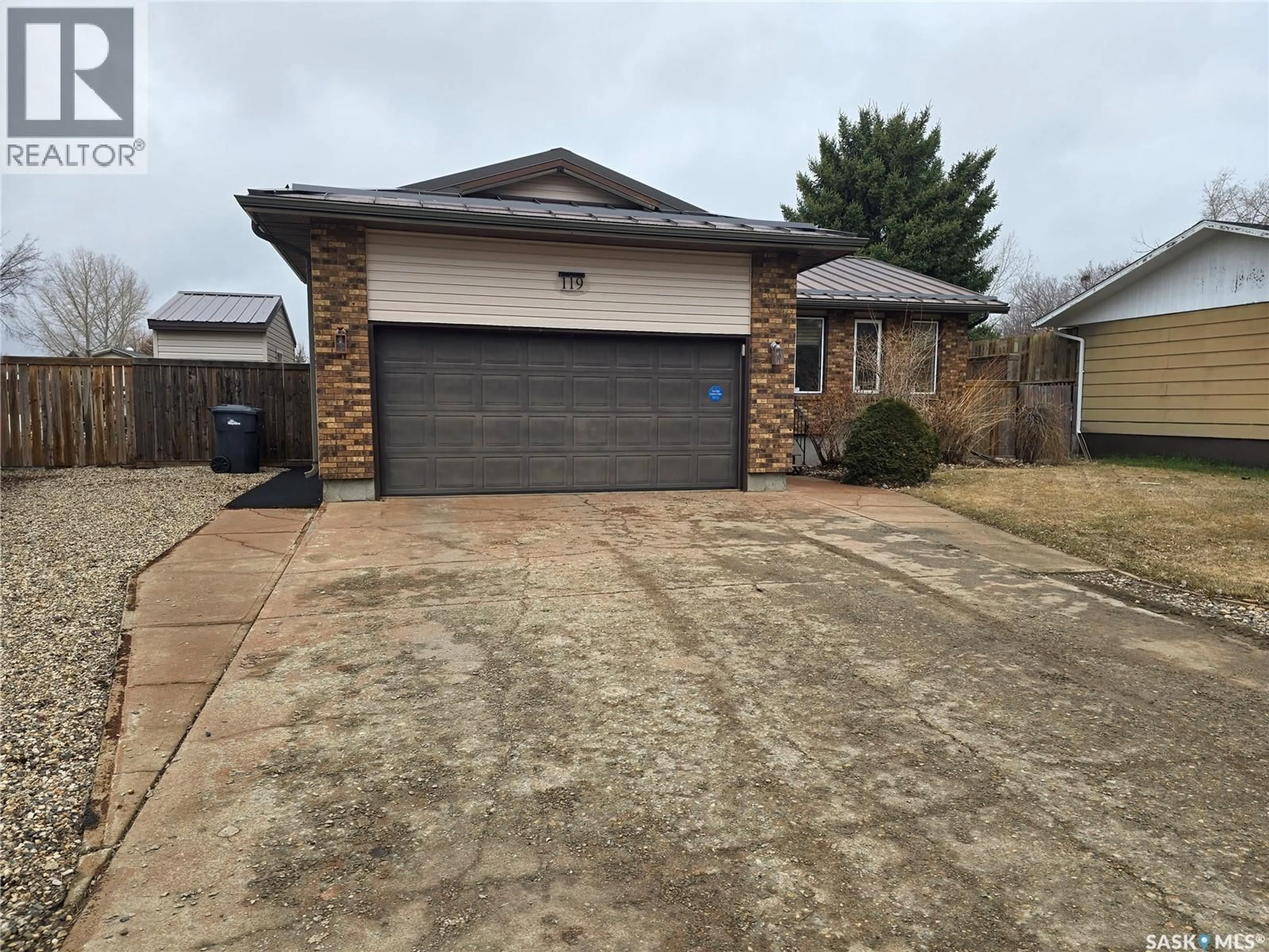 Home with brick exterior material, street for 119 MONTGOMERY CRESCENT, Weyburn Saskatchewan S4H2X6