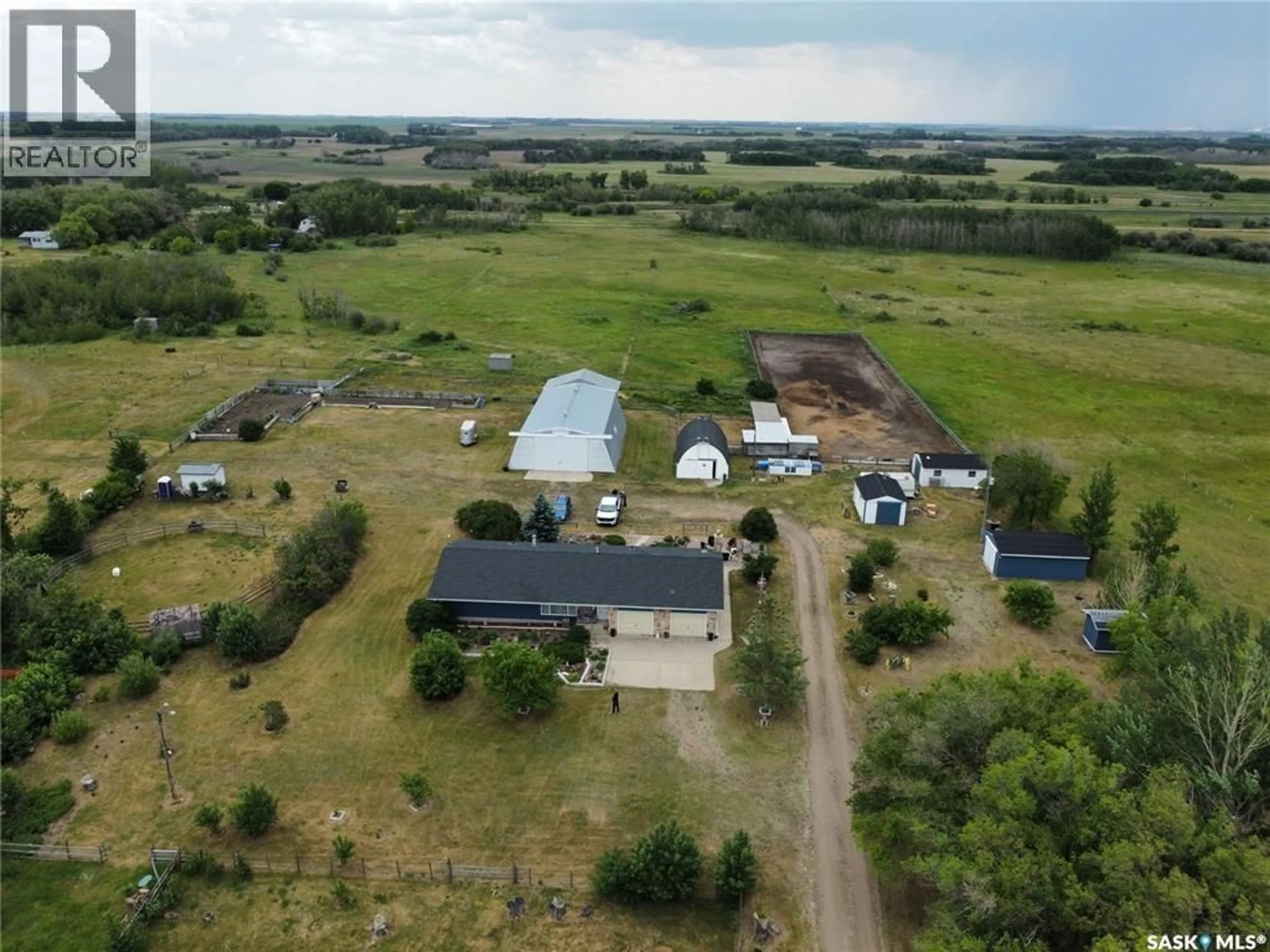 A pic from outside/outdoor area/front of a property/back of a property/a pic from drone, building for 55 GRANDORA ACRE HOBBY FARM, Vanscoy Rm No. 345 Saskatchewan S0K1V0