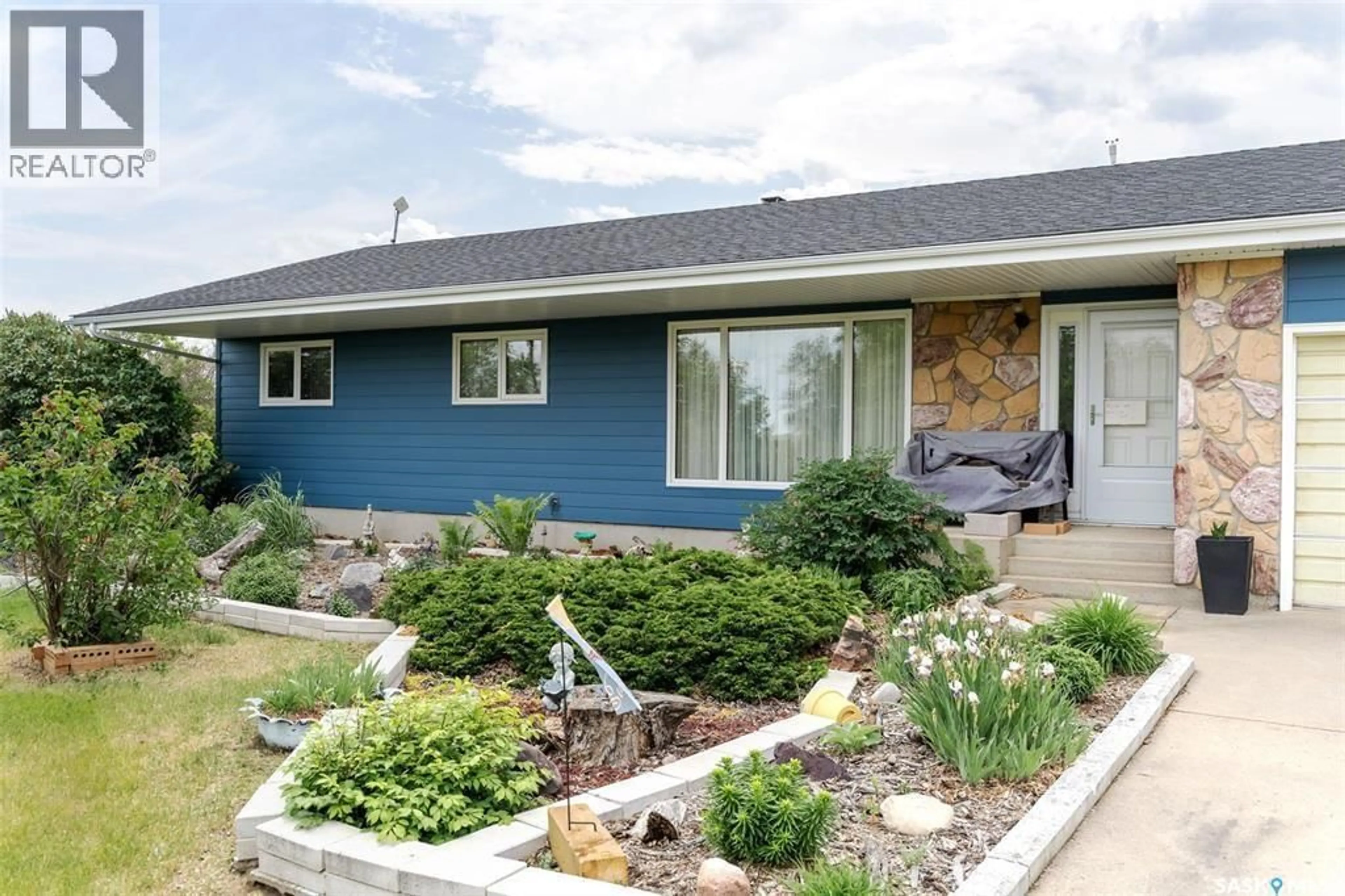 Home with vinyl exterior material, street for 55 GRANDORA ACRE HOBBY FARM, Vanscoy Rm No. 345 Saskatchewan S0K1V0