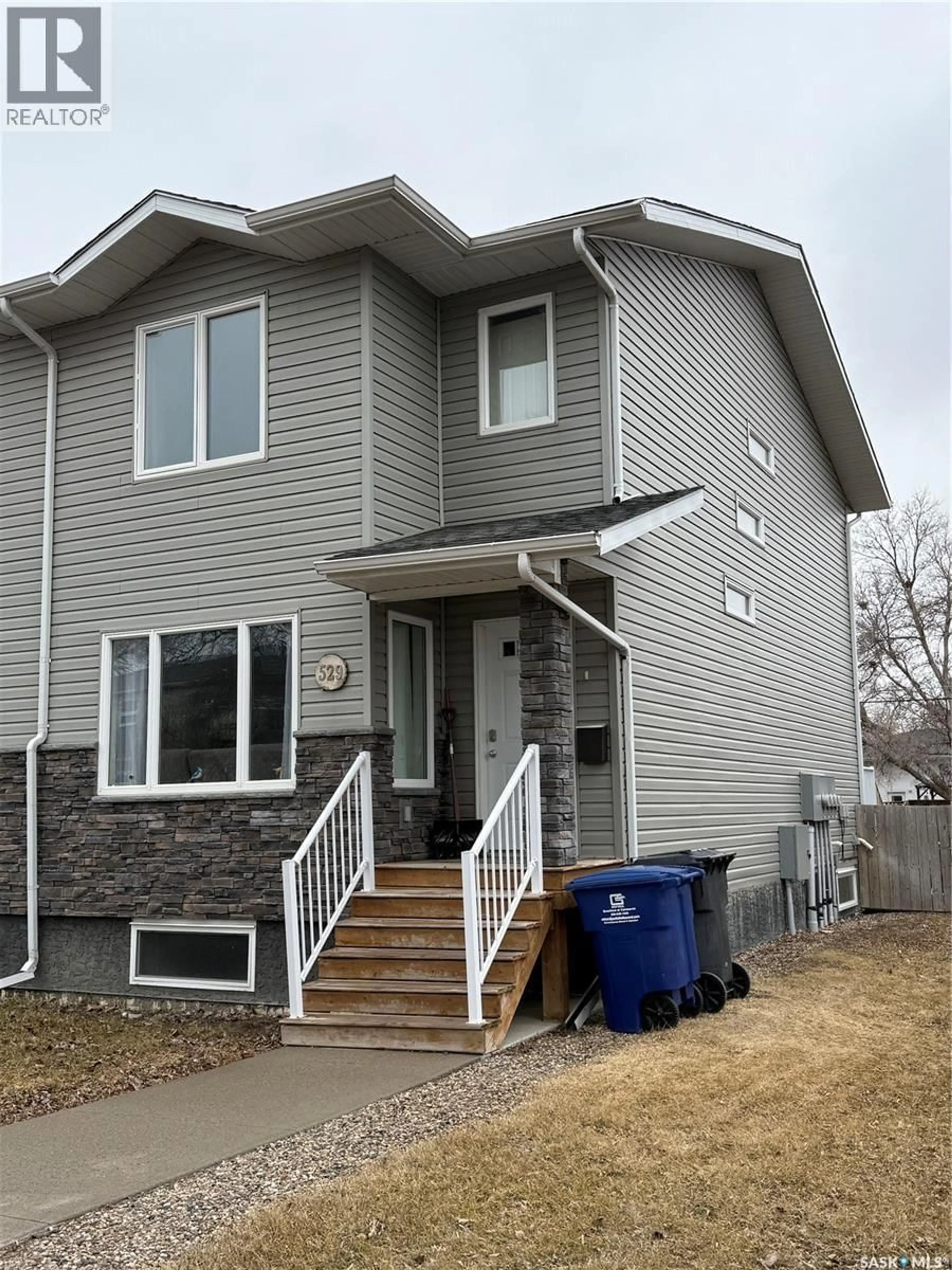 Home with vinyl exterior material, street for 529 ALEXANDRA STREET, Weyburn Saskatchewan S4H1R7