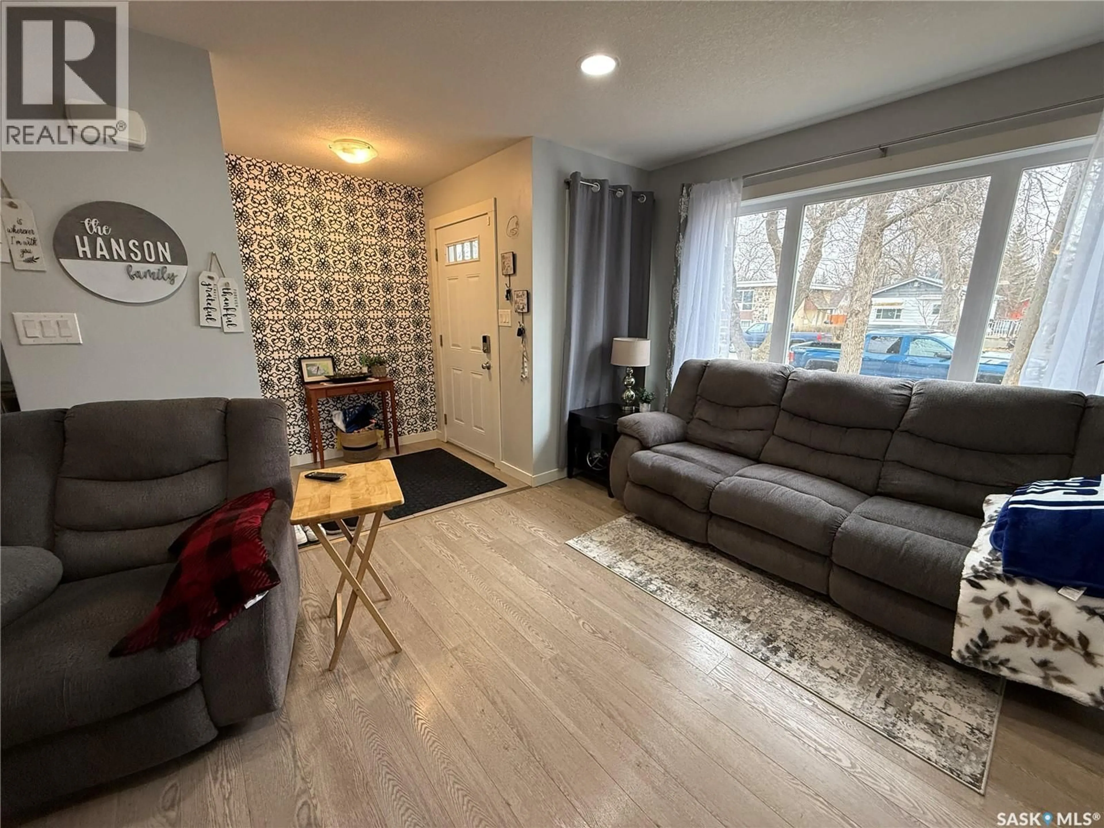 Living room with furniture, wood/laminate floor for 529 ALEXANDRA STREET, Weyburn Saskatchewan S4H1R7