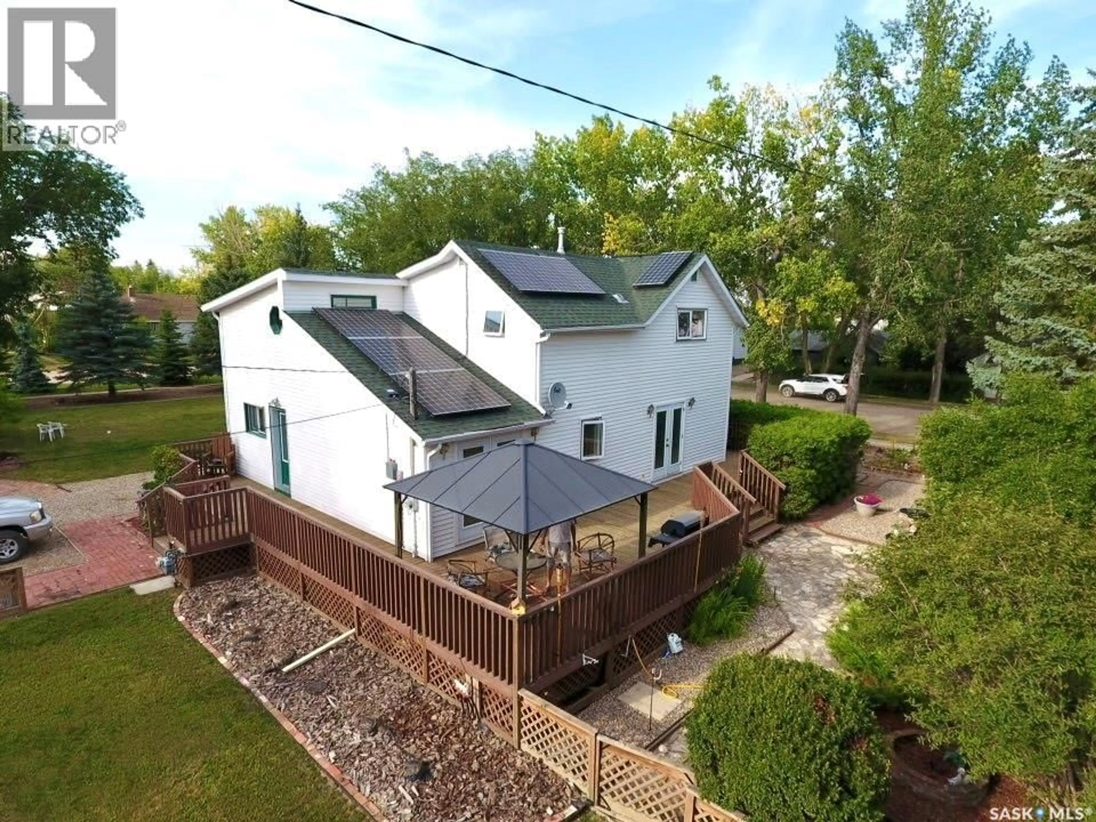 A pic from outside/outdoor area/front of a property/back of a property/a pic from drone, building for 106 2ND STREET, Dinsmore Saskatchewan S0L0T0
