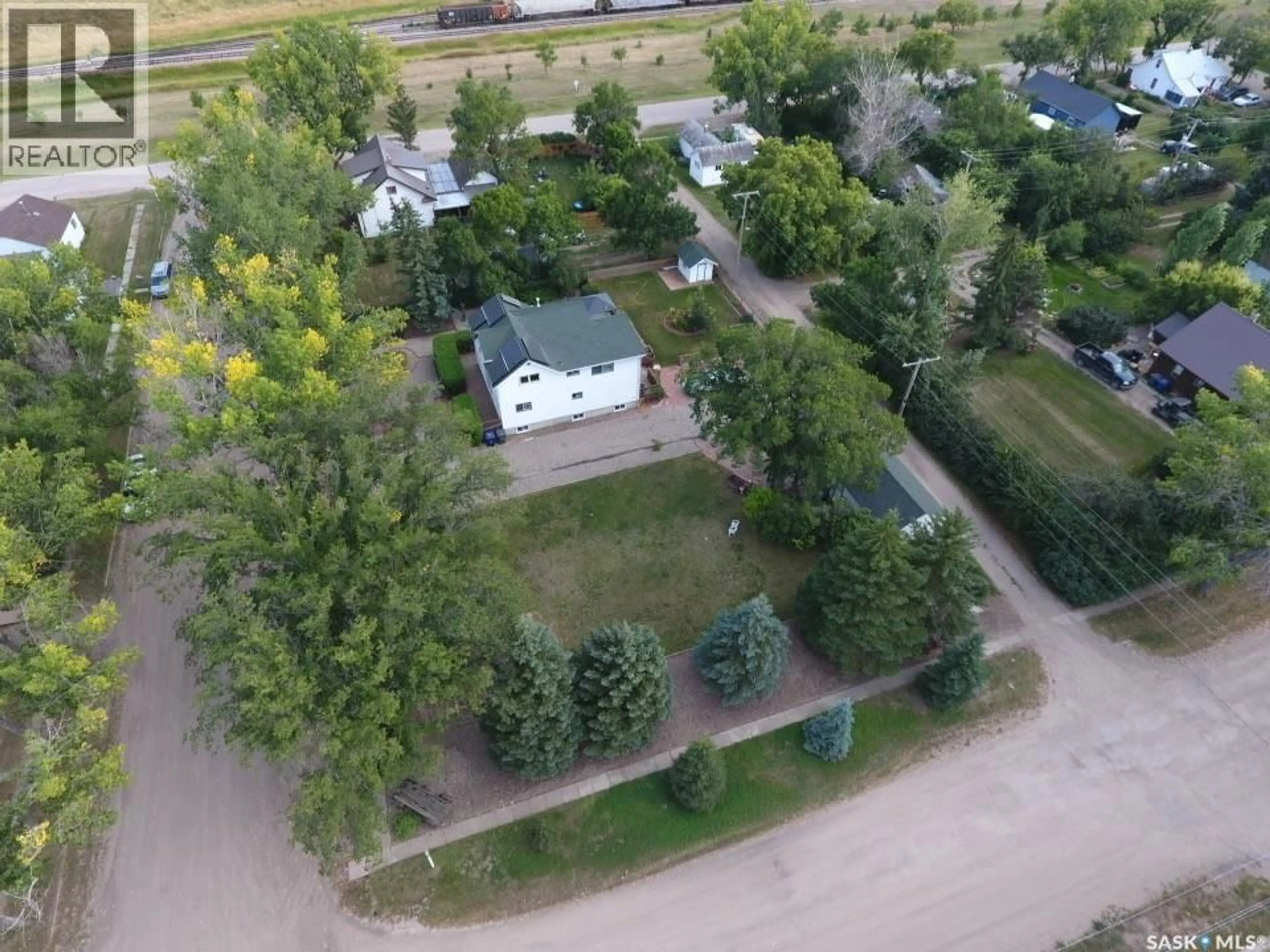 A pic from outside/outdoor area/front of a property/back of a property/a pic from drone, street for 106 2ND STREET, Dinsmore Saskatchewan S0L0T0