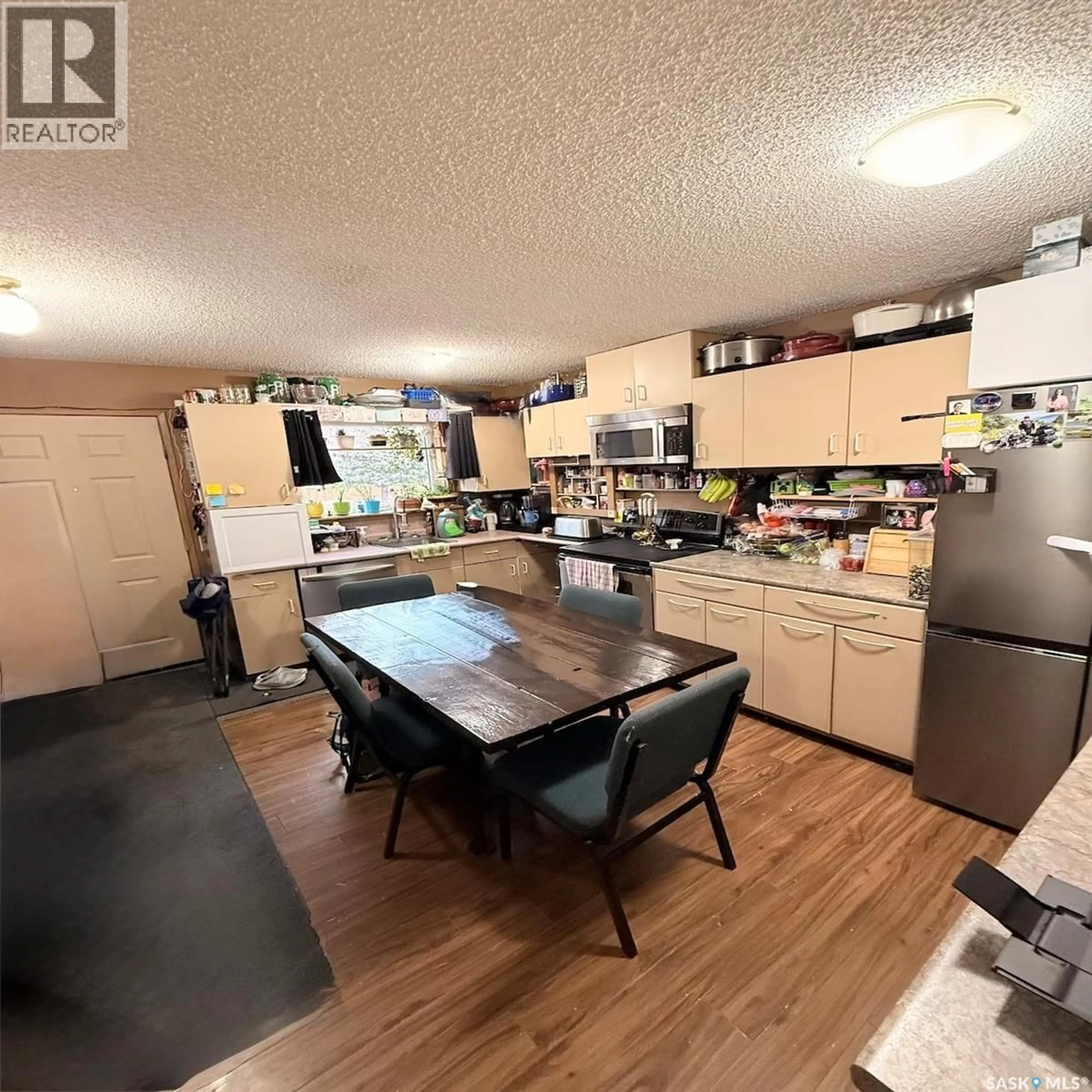 Open concept kitchen, wood/laminate floor for 140 - 420 MEILICKE ROAD, Saskatoon Saskatchewan S7K7Y5