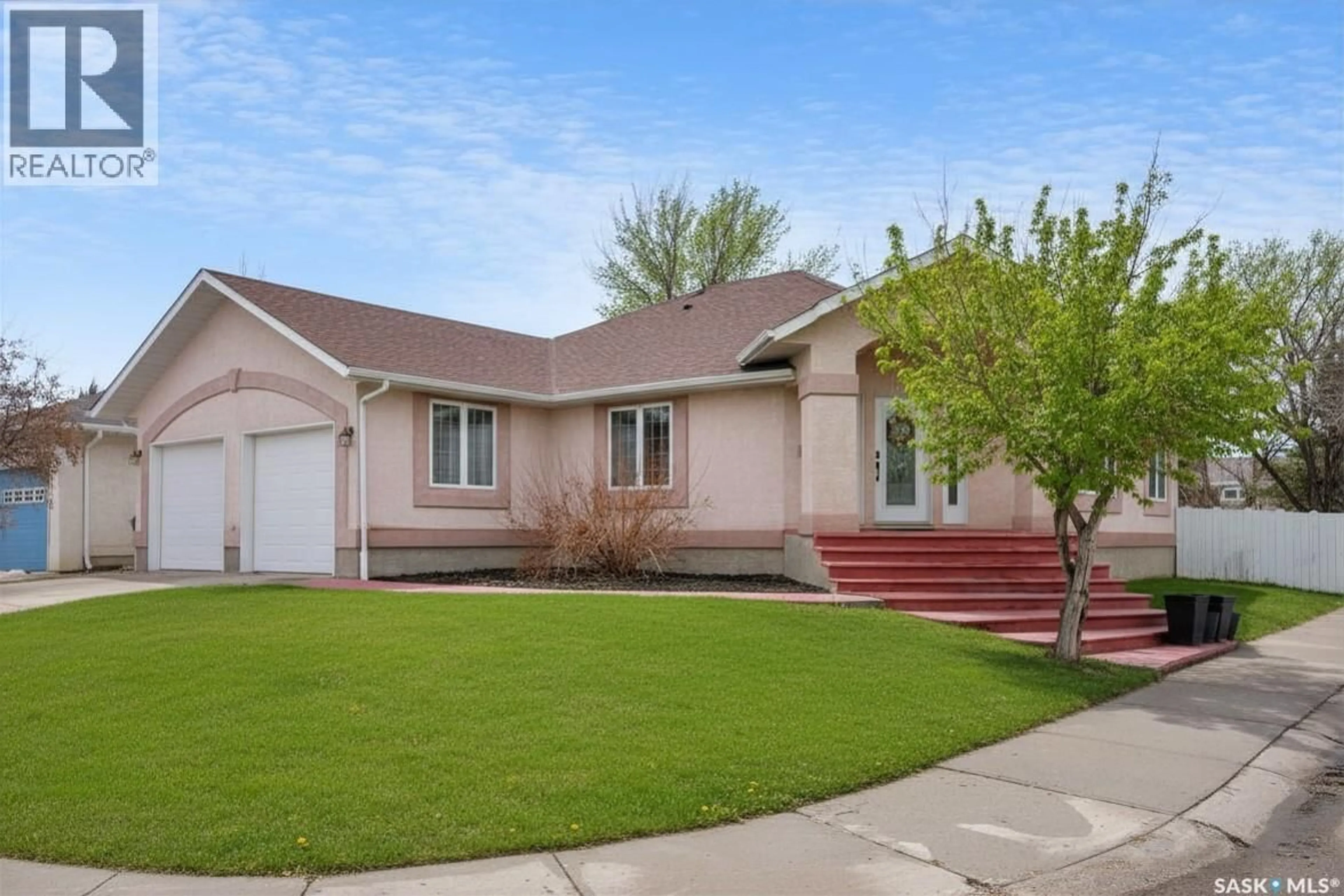 Home with vinyl exterior material, street for 65 JASMINE COURT, Moose Jaw Saskatchewan S6J1K2