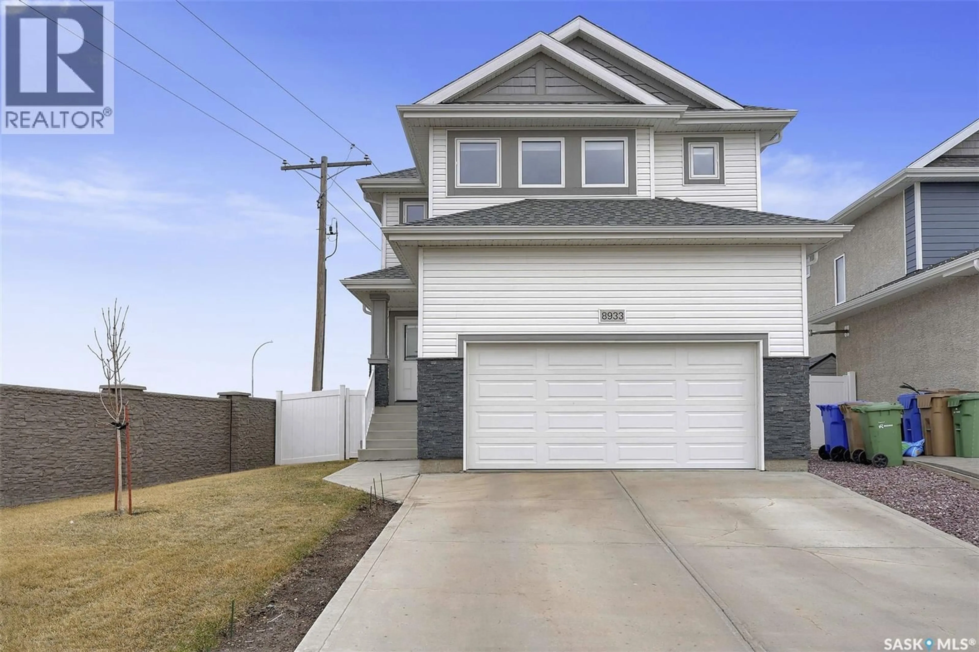 Home with vinyl exterior material, street for 8933 KESTRAL DRIVE, Regina Saskatchewan S4Y0C2