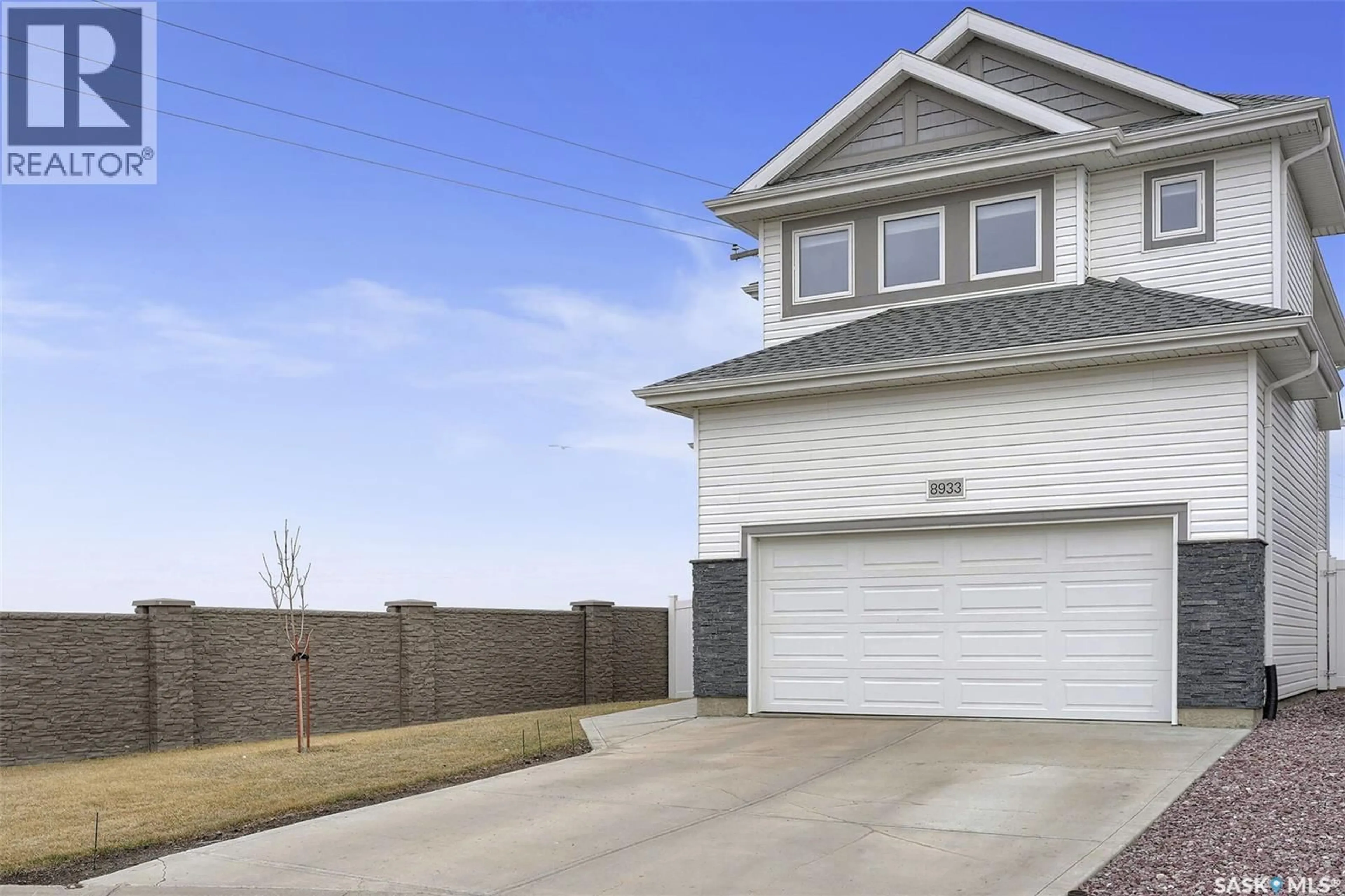Home with vinyl exterior material, street for 8933 KESTRAL DRIVE, Regina Saskatchewan S4Y0C2