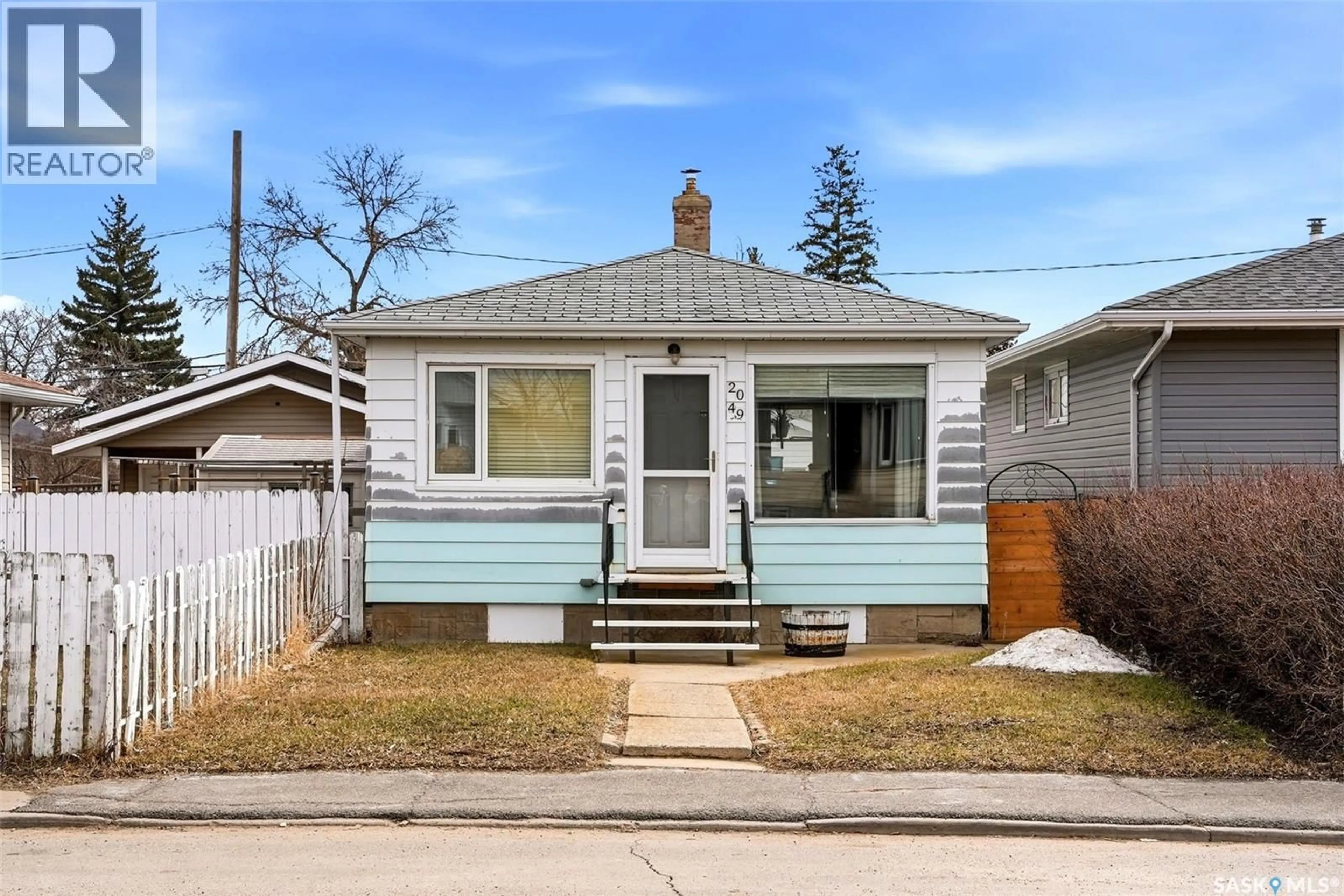 Home with vinyl exterior material, street for 2049 FLEURY STREET, Regina Saskatchewan S4N2M1
