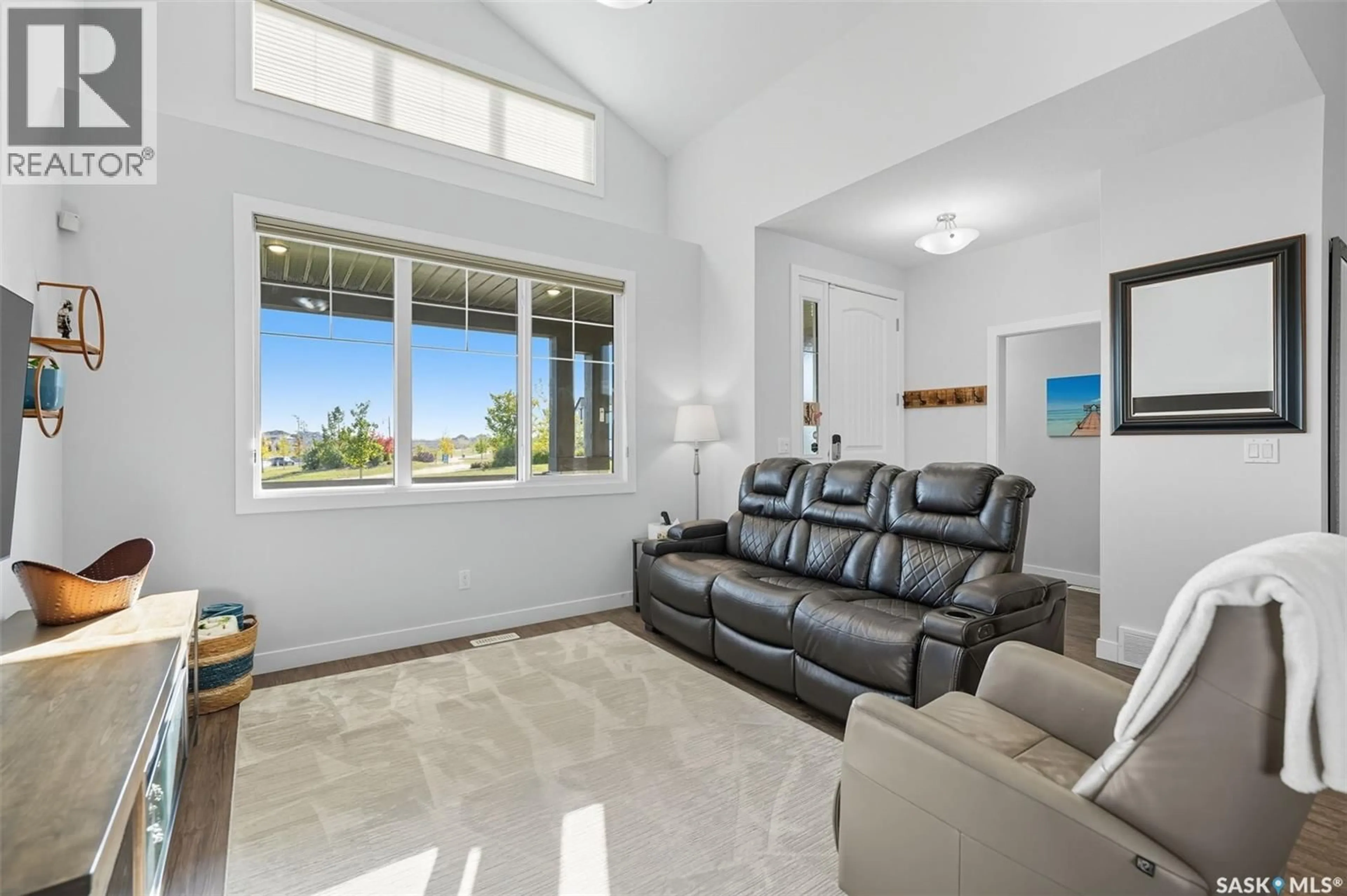Living room with furniture, ceramic/tile floor for 687 SECORD BEND, Saskatoon Saskatchewan S7V0M7