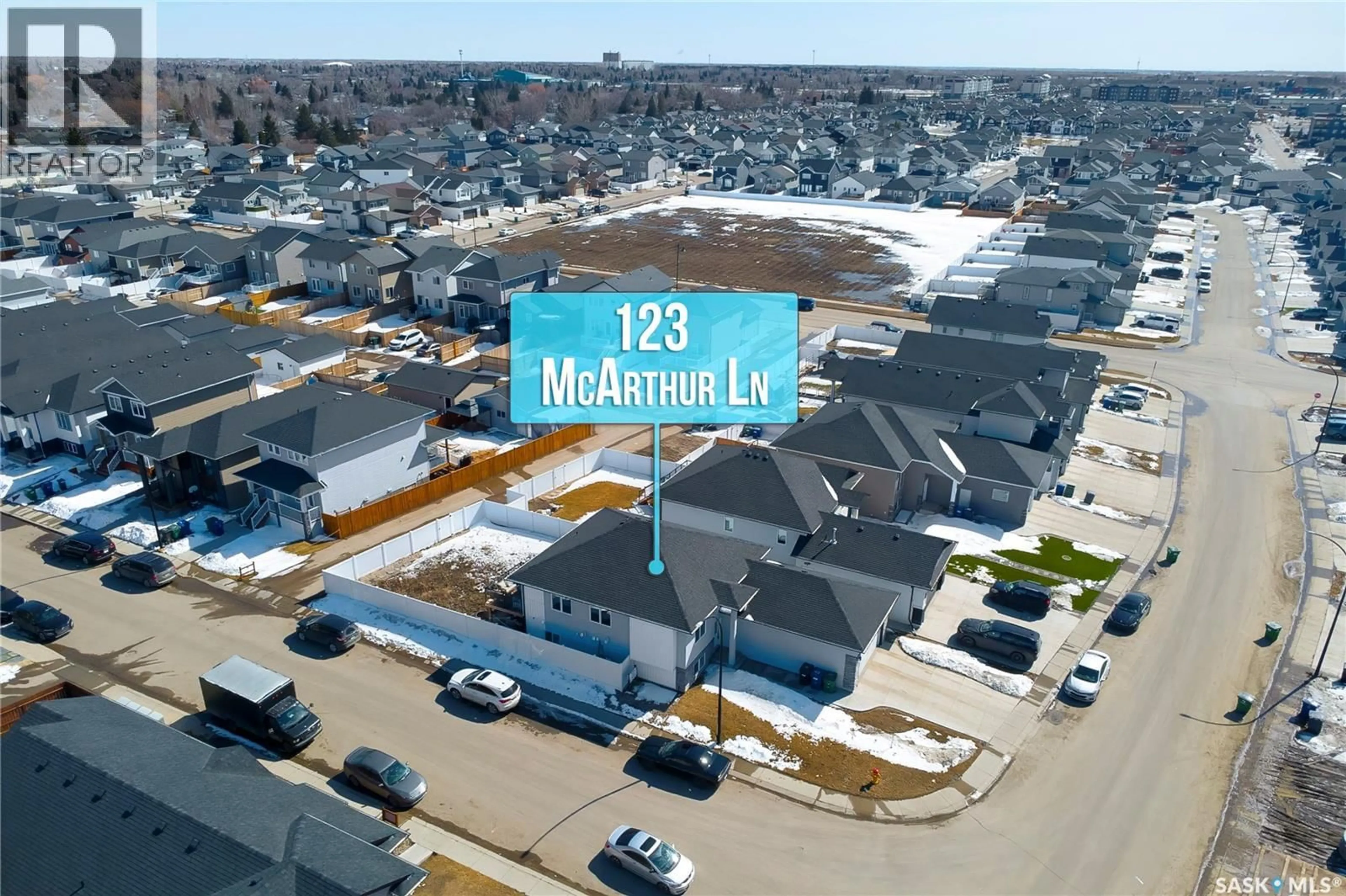 A pic from outside/outdoor area/front of a property/back of a property/a pic from drone, street for 123 MCARTHUR LANE, Saskatoon Saskatchewan S7L6X5