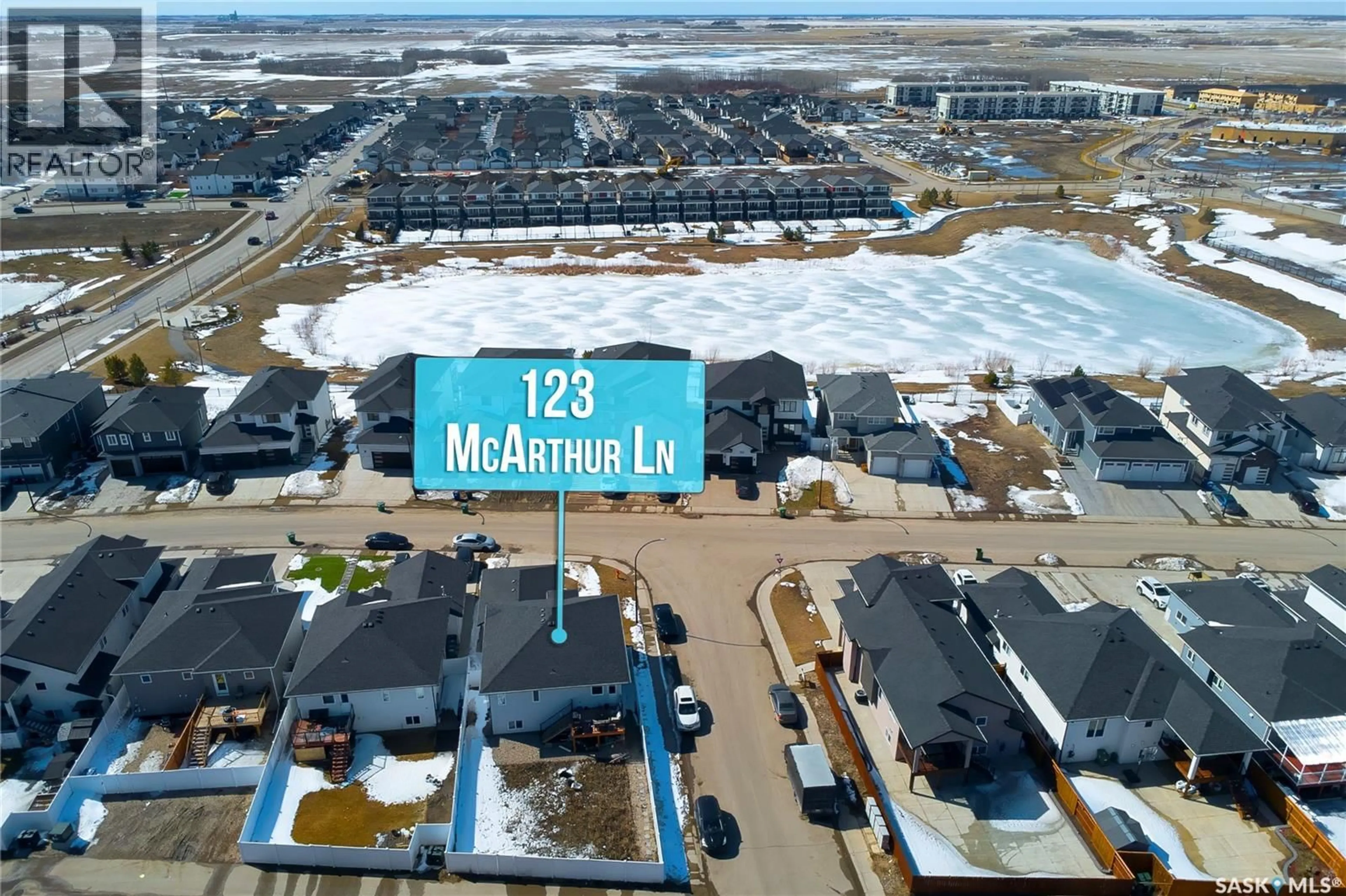 A pic from outside/outdoor area/front of a property/back of a property/a pic from drone, mountain view for 123 MCARTHUR LANE, Saskatoon Saskatchewan S7L6X5