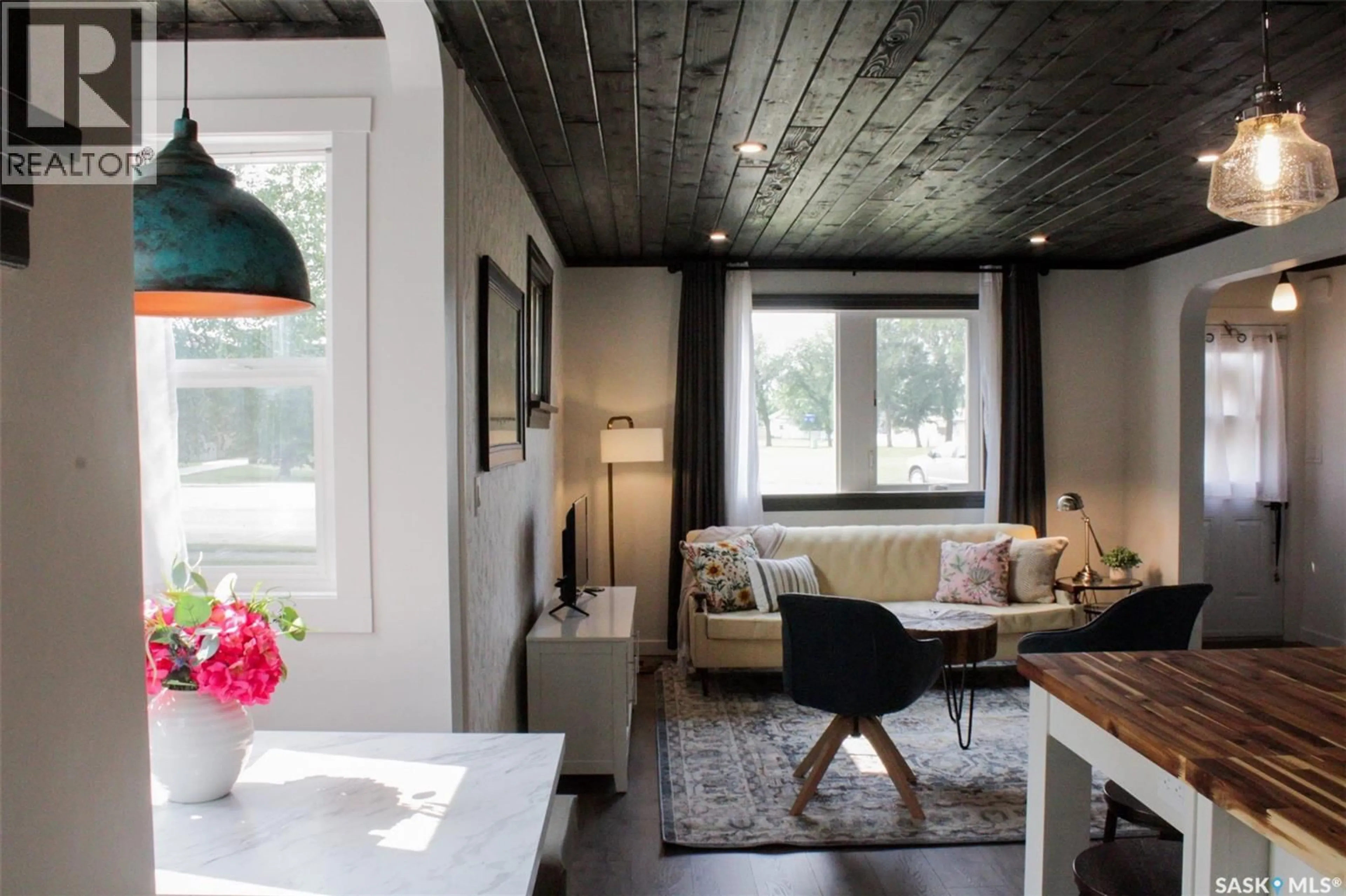 Living room with furniture, wood/laminate floor for 2014 3RD STREET, Rosthern Saskatchewan S0K3R0