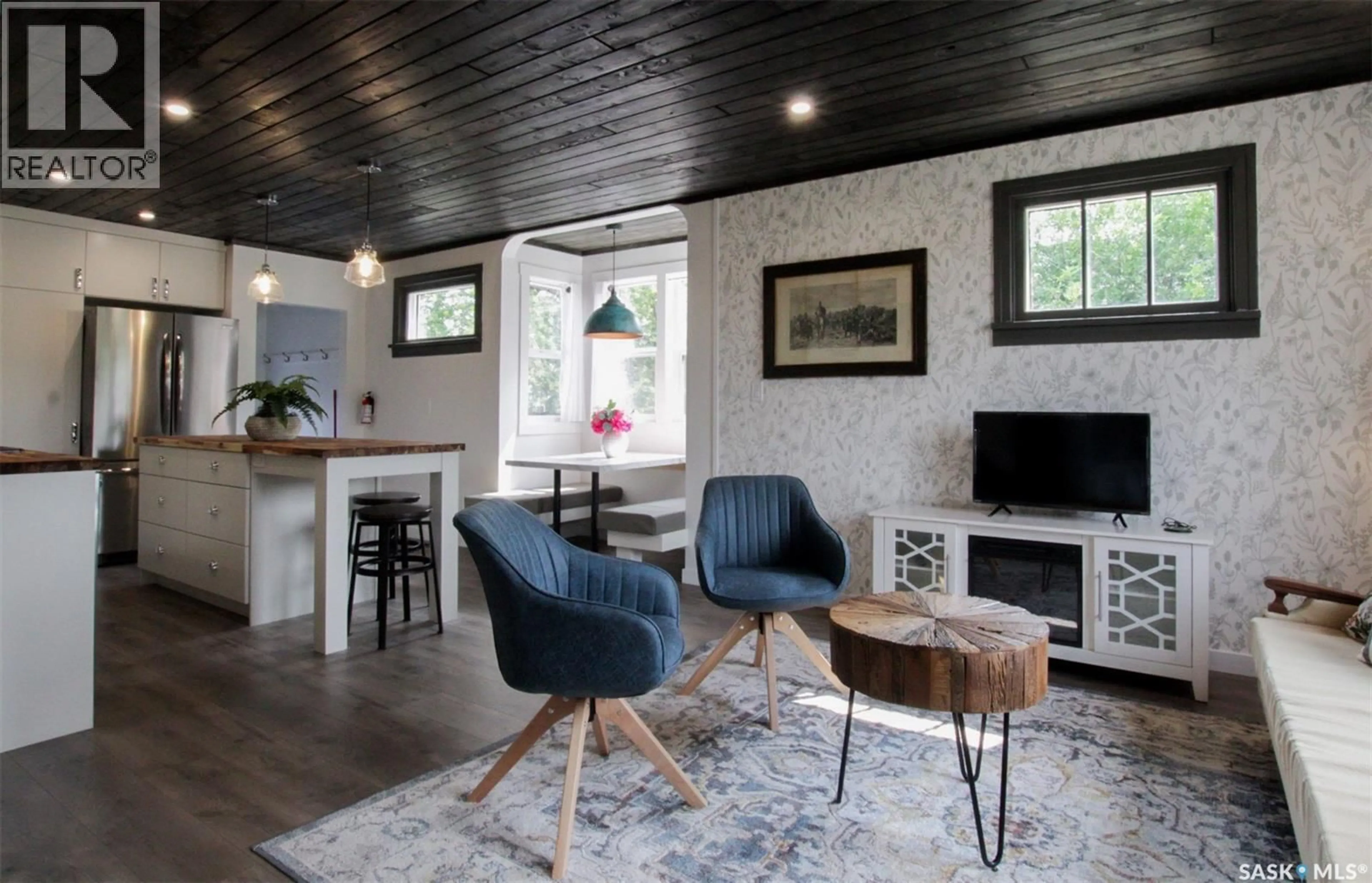 Living room with furniture, wood/laminate floor for 2014 3RD STREET, Rosthern Saskatchewan S0K3R0