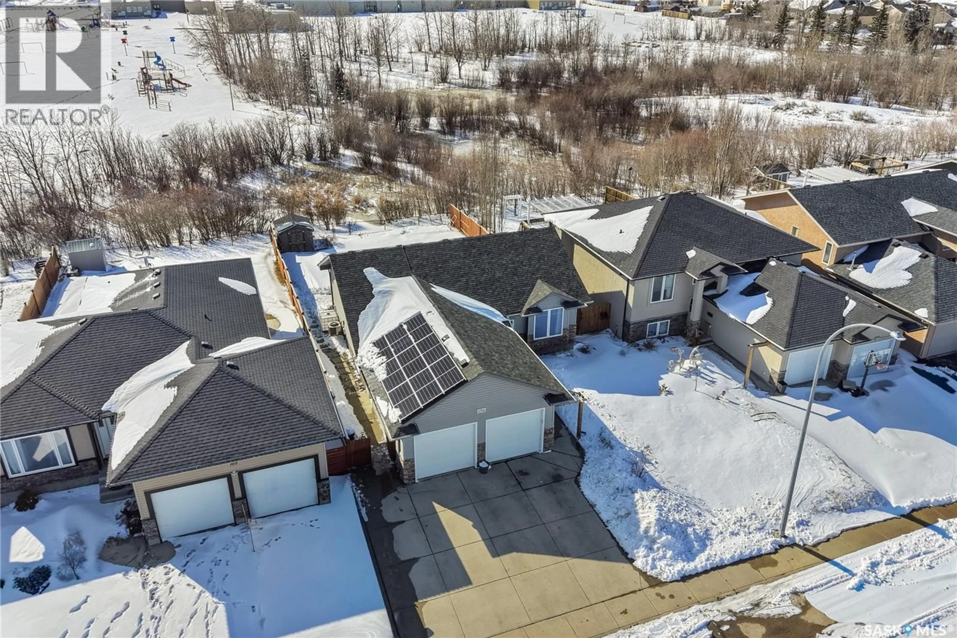 A pic from outside/outdoor area/front of a property/back of a property/a pic from drone, street for 156 MACCORMACK ROAD, Martensville Saskatchewan S0K0A2