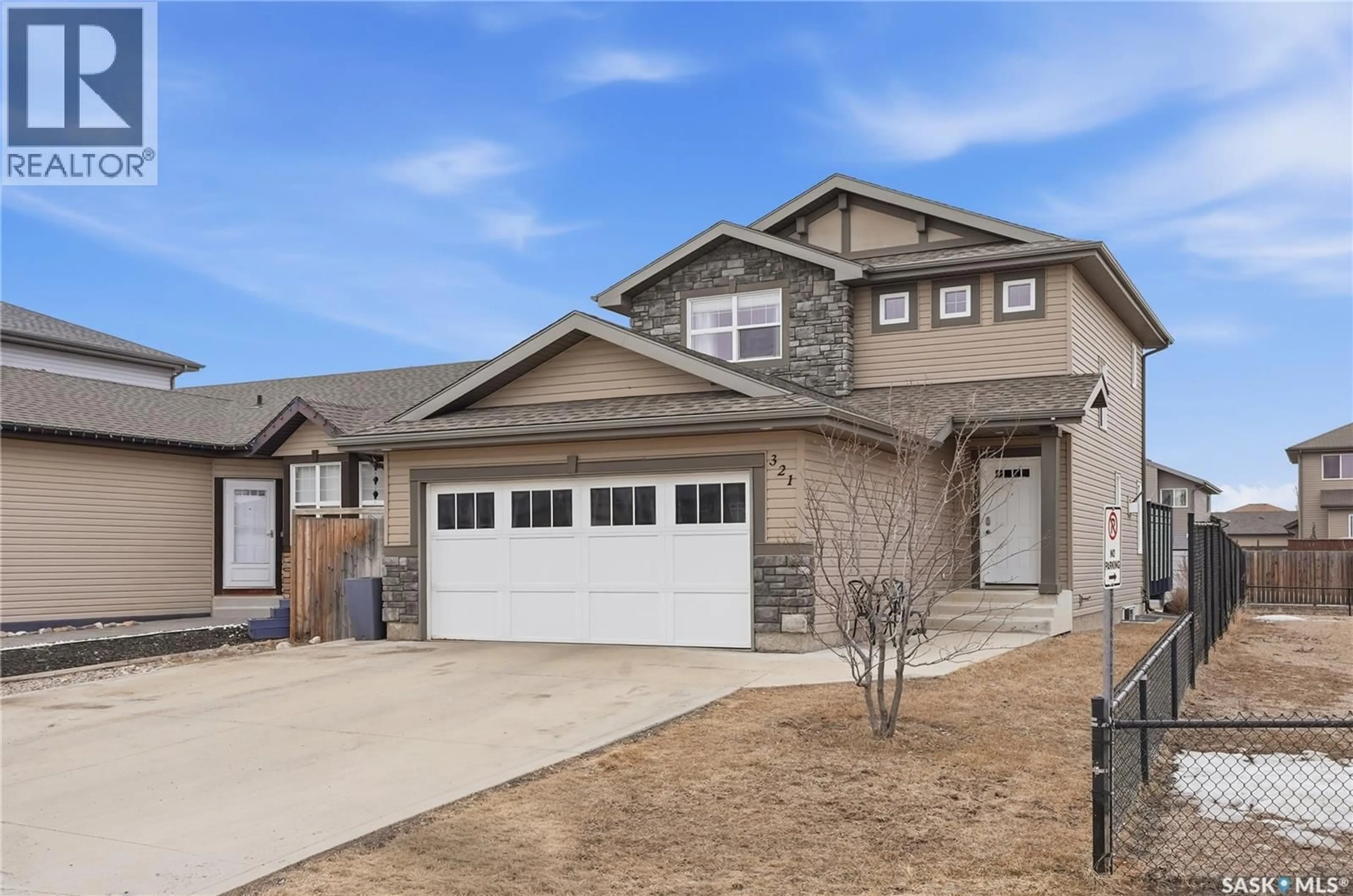 Home with vinyl exterior material, street for 321 STONE TERRACE, Martensville Saskatchewan S0K0A2