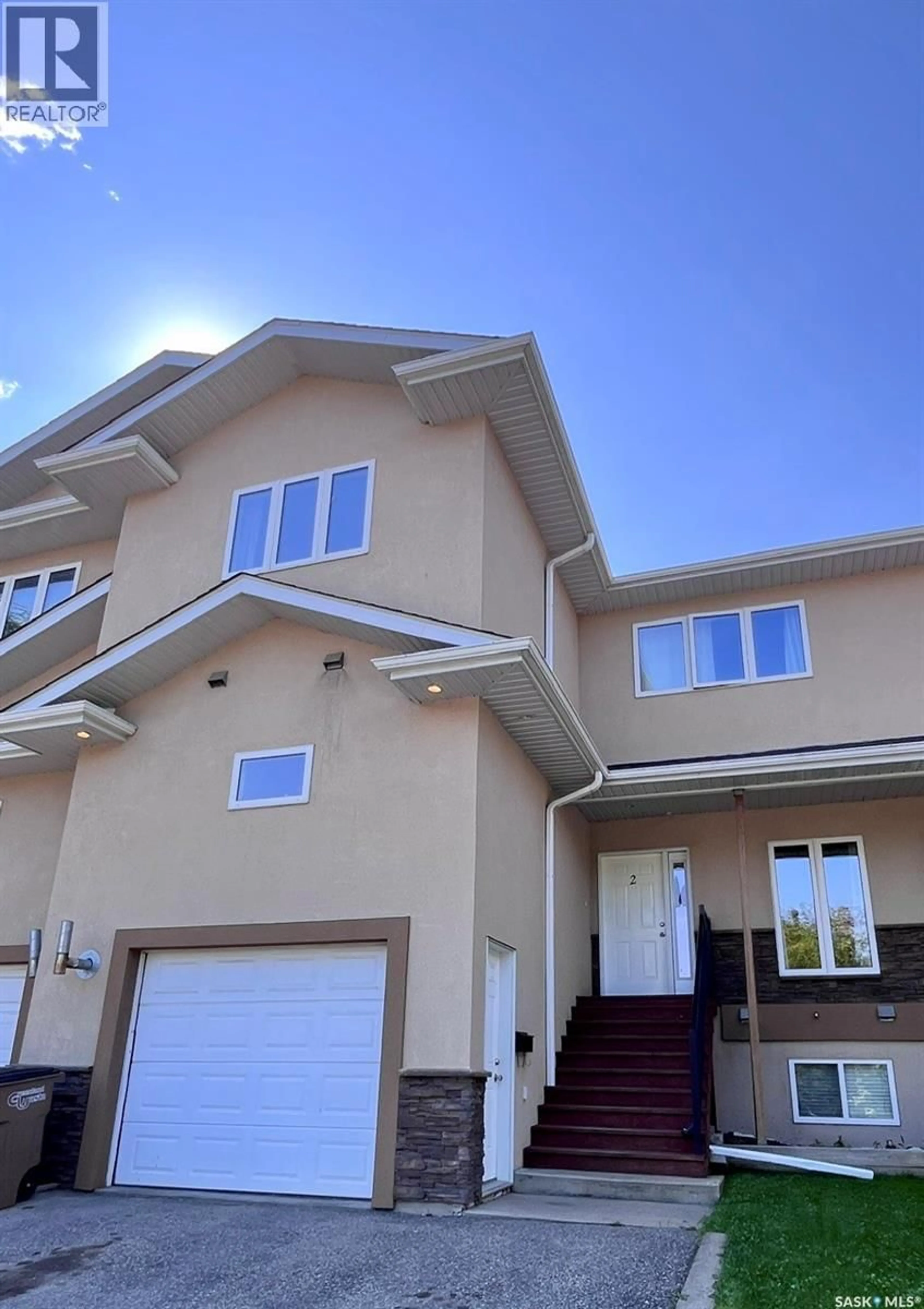 Home with vinyl exterior material, street for 2 211 20TH STREET, Prince Albert Saskatchewan S6V4G5