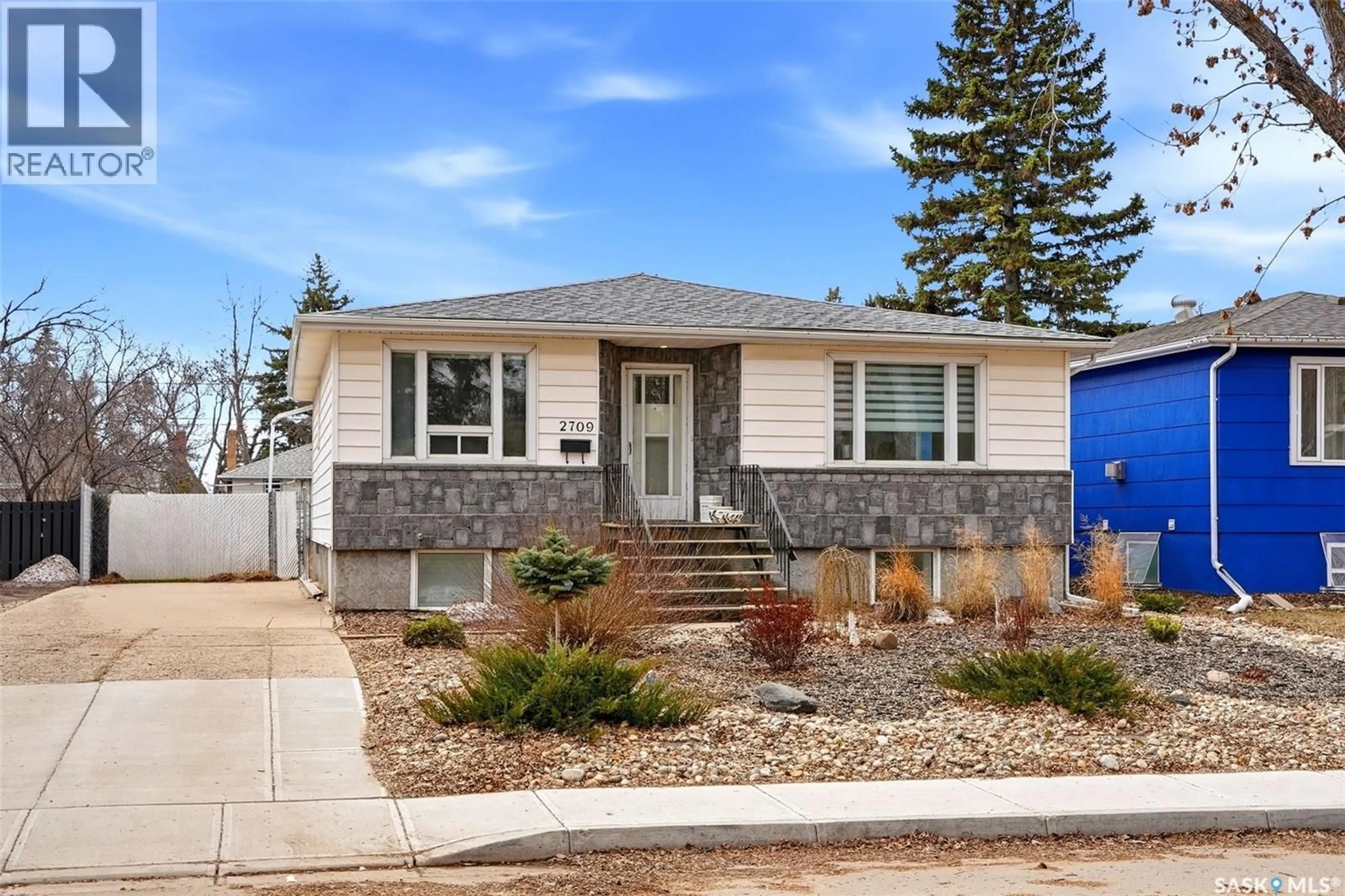 Home with vinyl exterior material, street for 2709 24TH AVENUE, Regina Saskatchewan S4S1J6