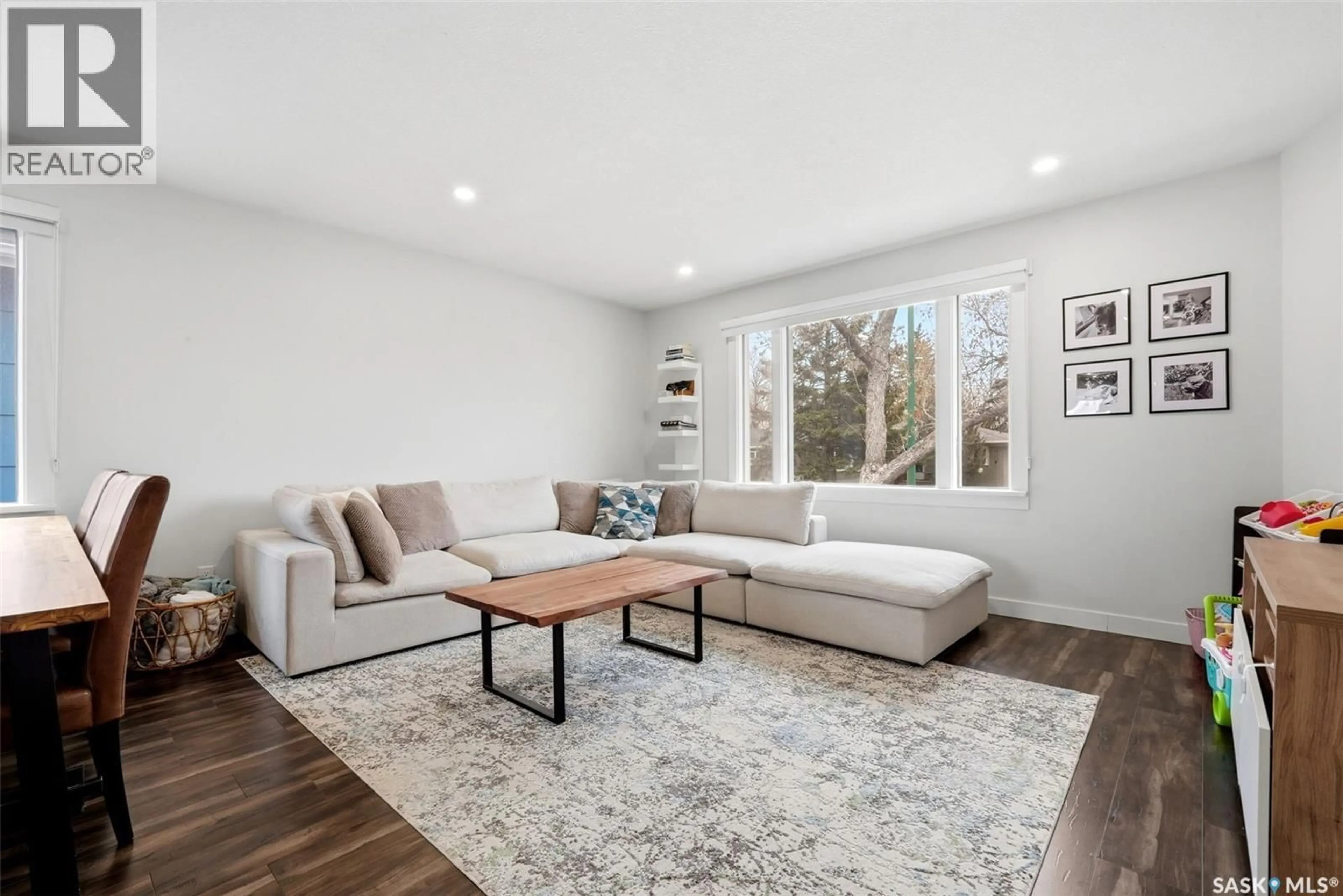 Living room with furniture, wood/laminate floor for 2709 24TH AVENUE, Regina Saskatchewan S4S1J6