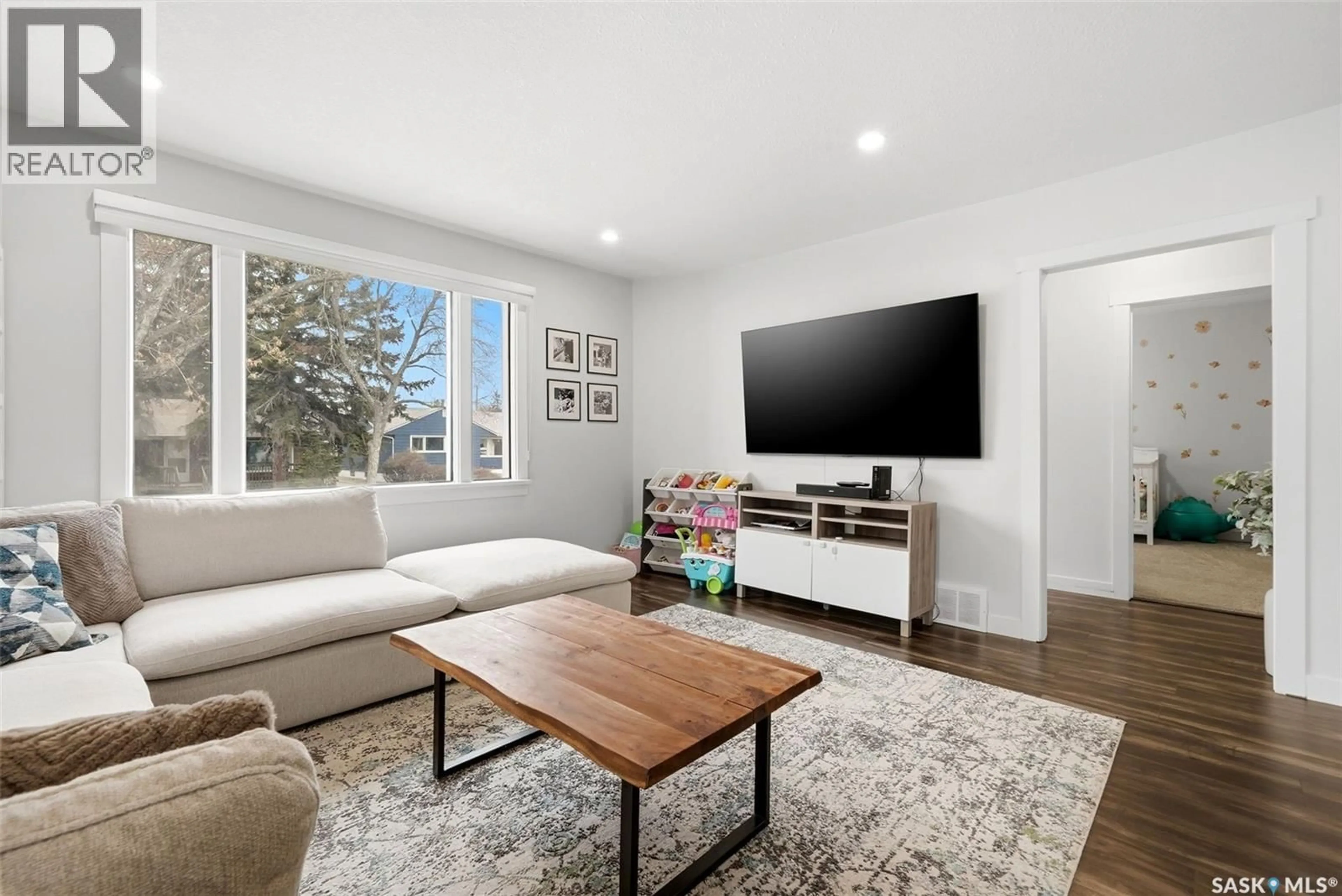 Living room with furniture, wood/laminate floor for 2709 24TH AVENUE, Regina Saskatchewan S4S1J6