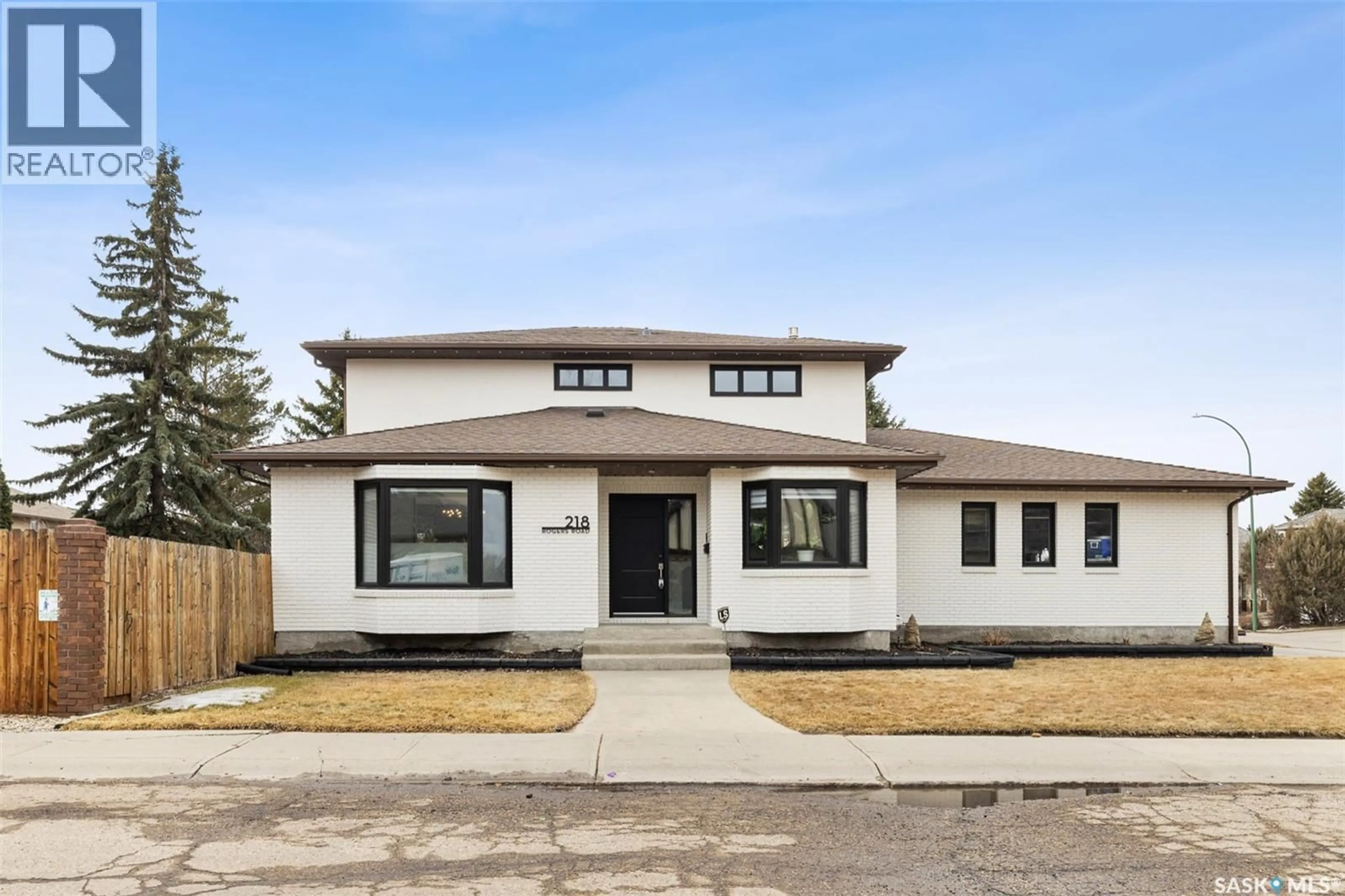 Home with brick exterior material, street for 218 ROGERS ROAD, Regina Saskatchewan S4S7C4