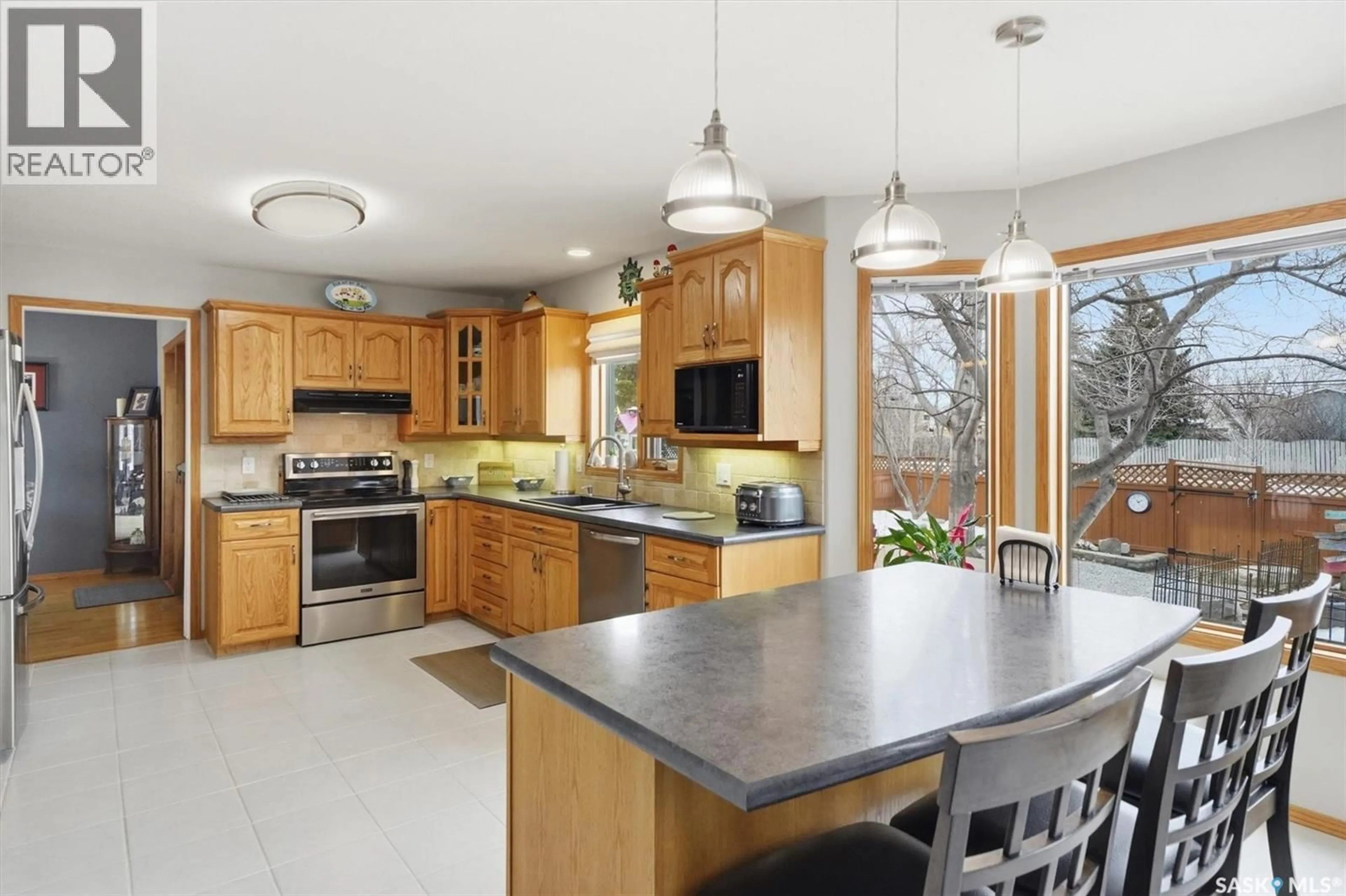 Open concept kitchen, ceramic/tile floor for 712 SLATER CRESCENT, Martensville Saskatchewan S0K2T0