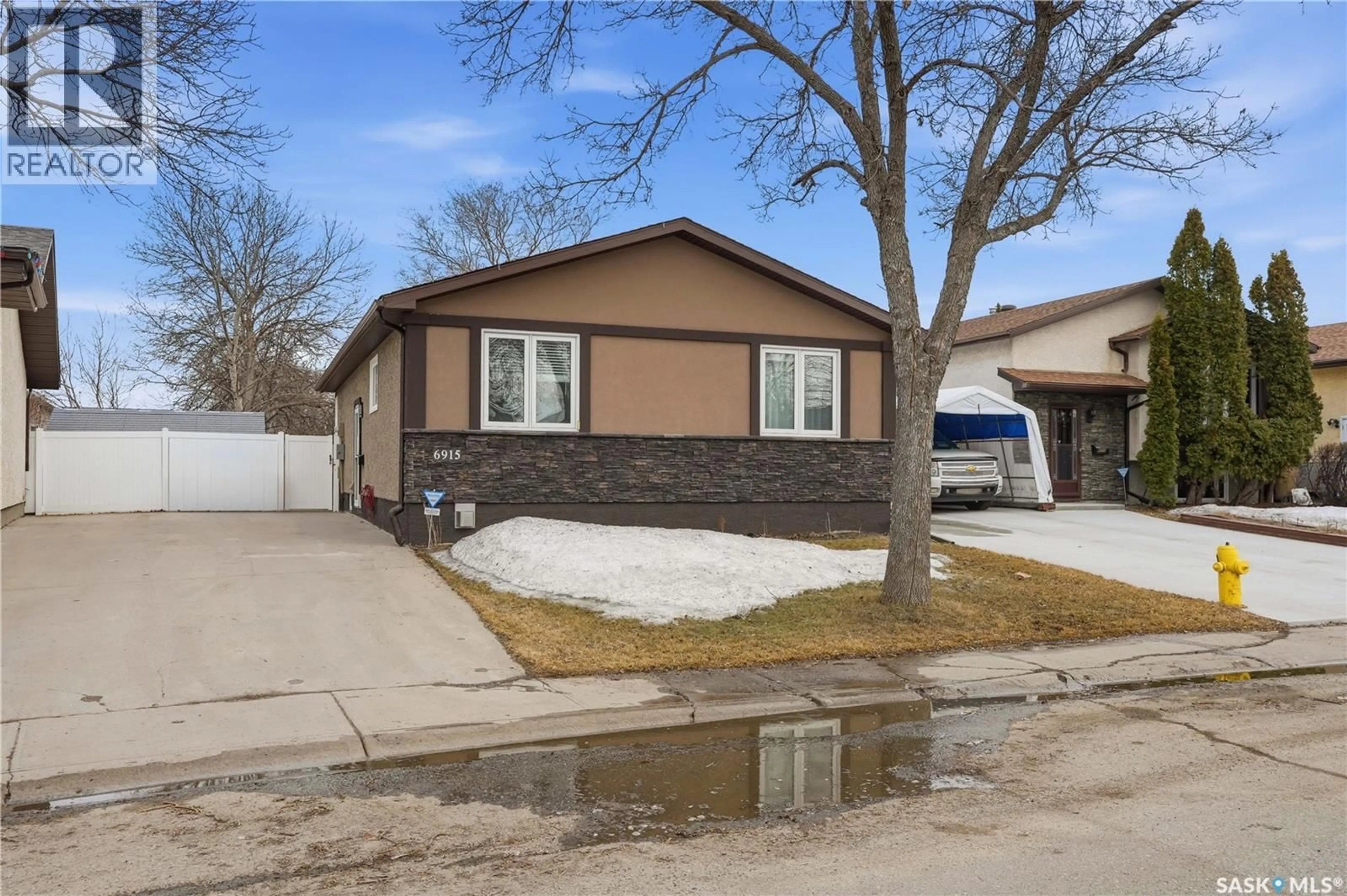 Home with vinyl exterior material, street for 6915 WHELAN DRIVE, Regina Saskatchewan S4X3W2