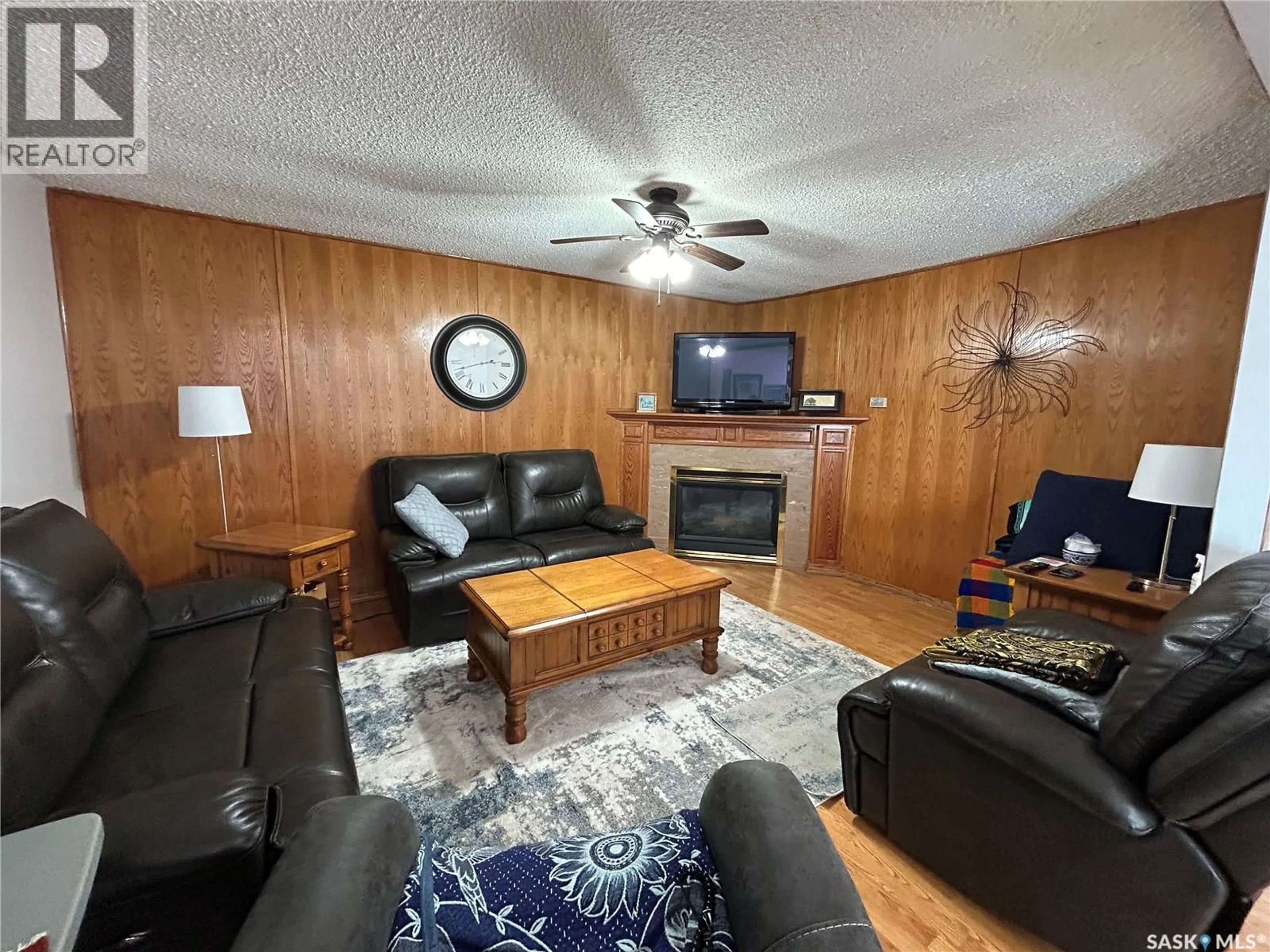 Living room with furniture, wood/laminate floor for 136 6TH STREET, Humboldt Saskatchewan S0K2A0