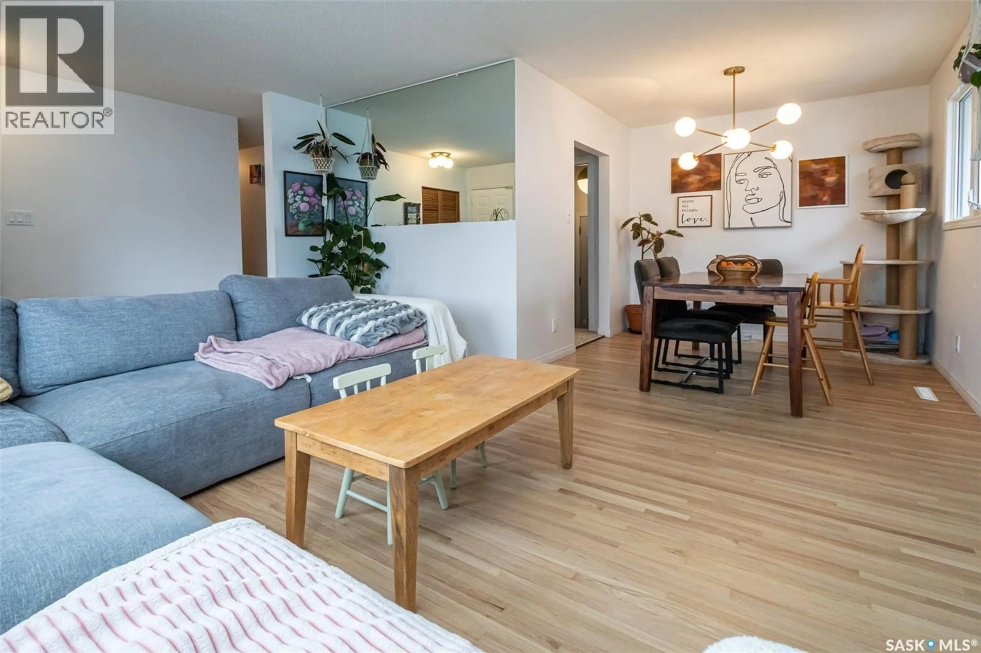 Living room with furniture, wood/laminate floor for 38 MORRIS DRIVE, Saskatoon Saskatchewan S7L3T9