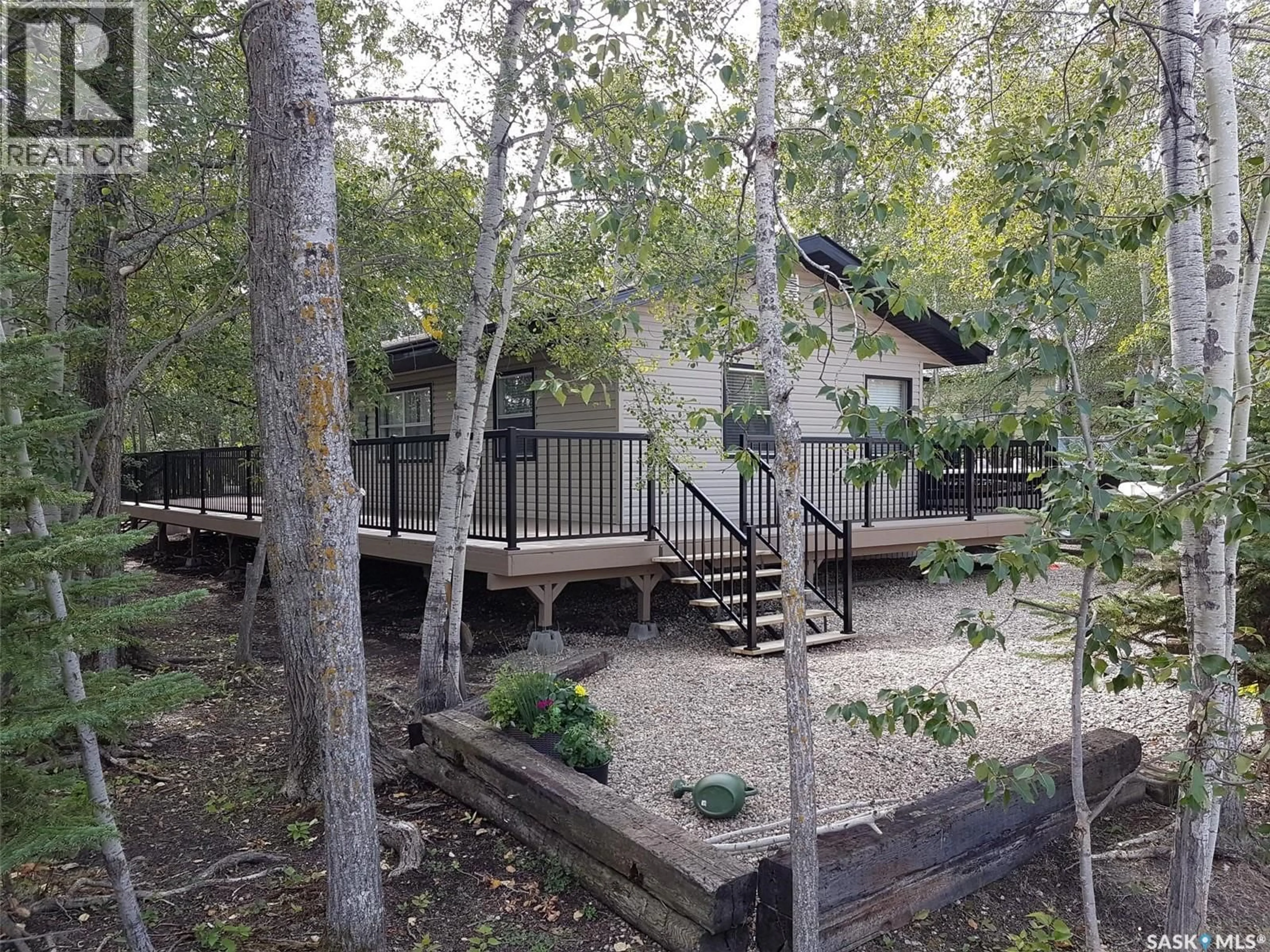 A pic from outside/outdoor area/front of a property/back of a property/a pic from drone, forest/trees view for 406 CAPALANO DRIVE, Good Spirit Lake Saskatchewan S0A0L1