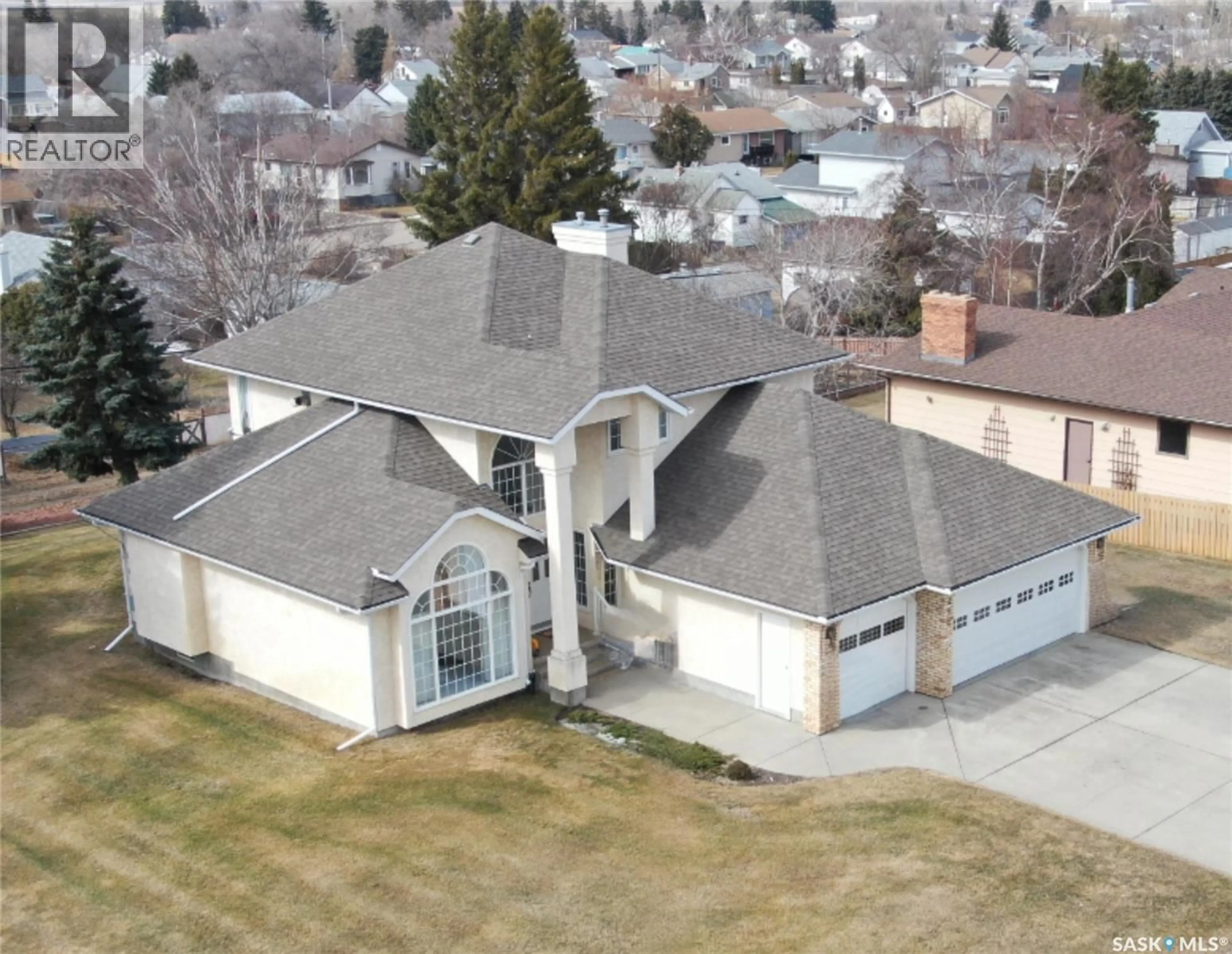 A pic from outside/outdoor area/front of a property/back of a property/a pic from drone, street for 202 7TH AVENUE, Biggar Saskatchewan S0K0M0