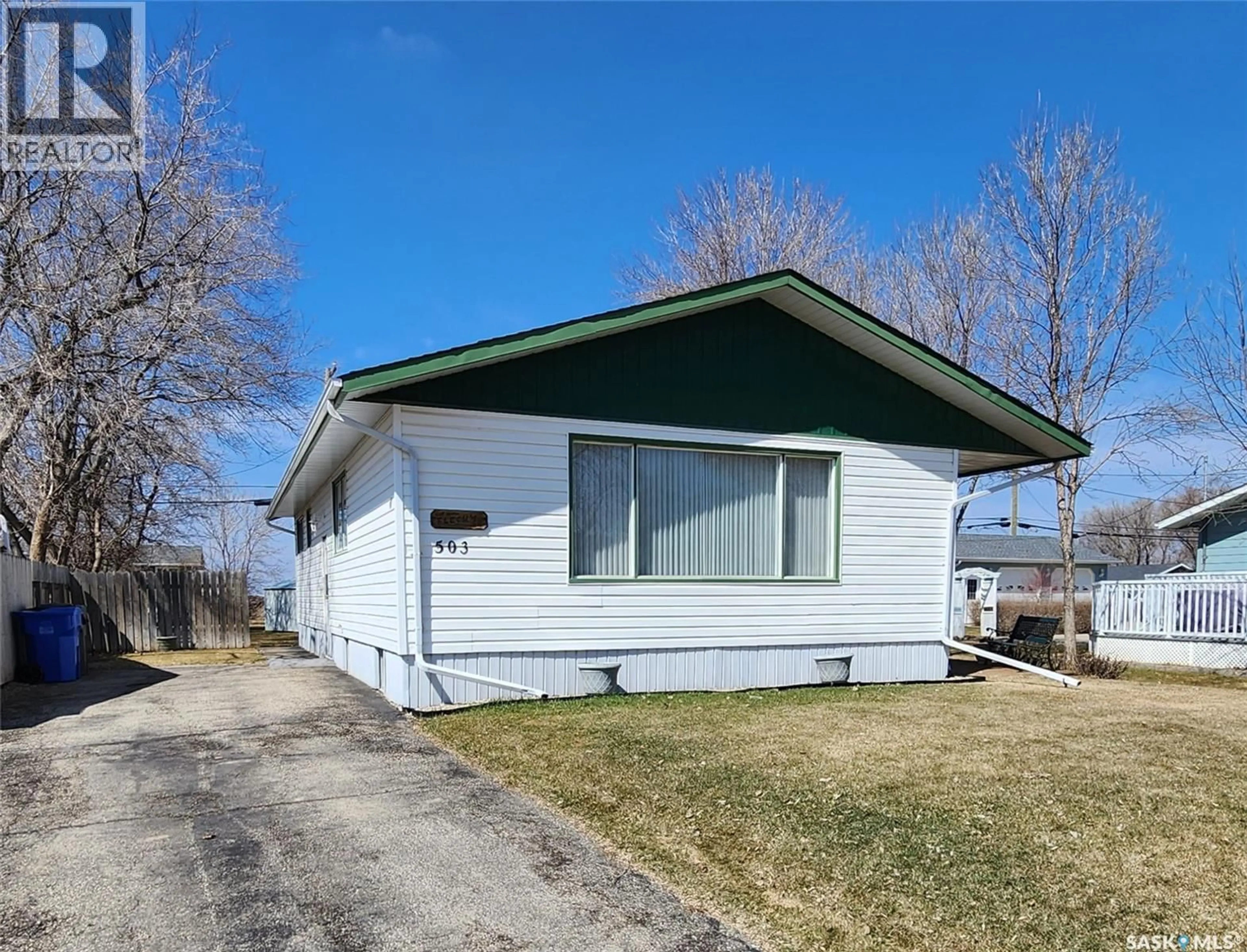 Home with vinyl exterior material, street for 503 1ST AVENUE, Lampman Saskatchewan S0C1N0