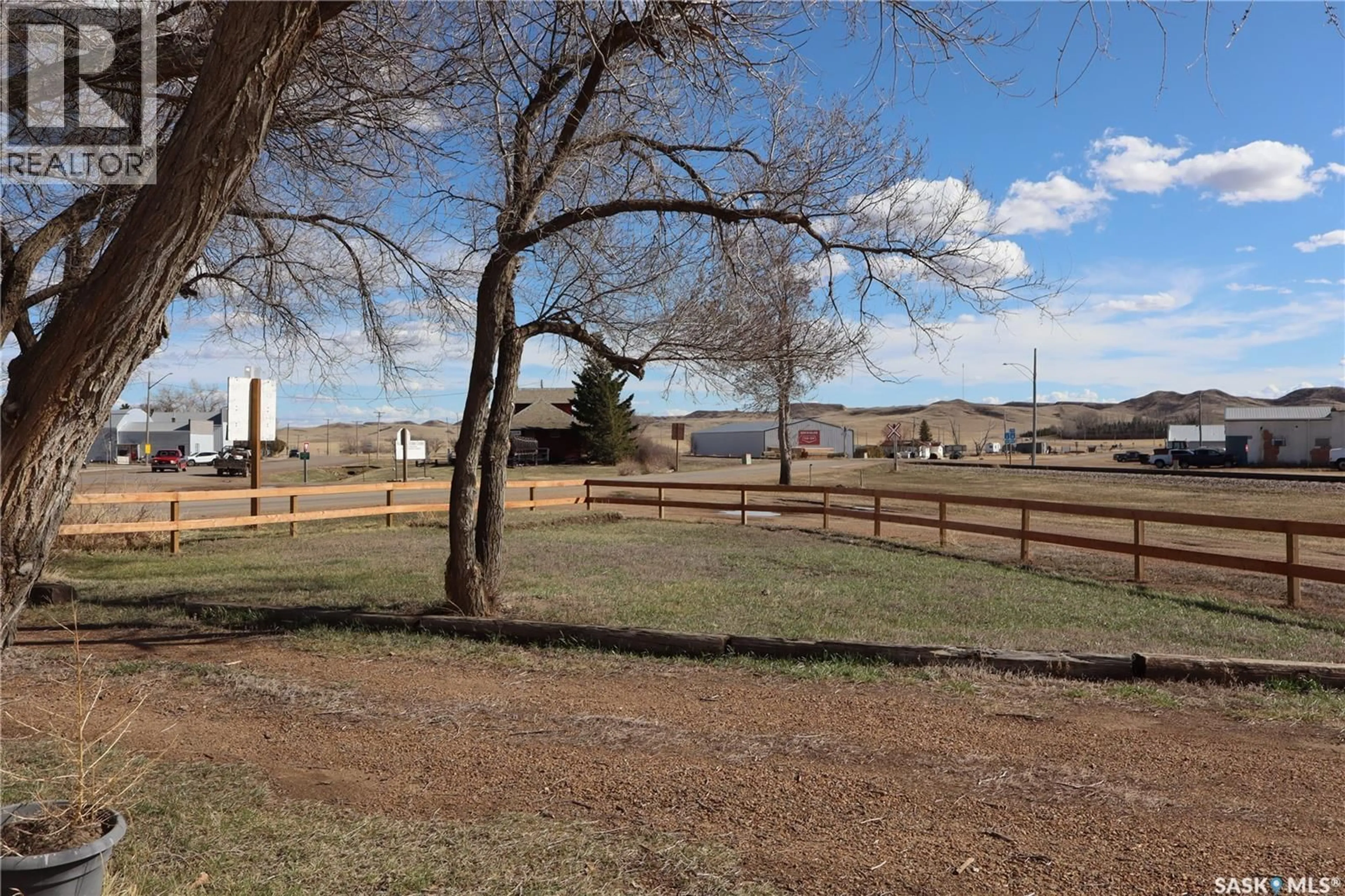 A pic from outside/outdoor area/front of a property/back of a property/a pic from drone, mountain view for 302 COLUMBUS DRIVE, Rockglen Saskatchewan S0H3R0