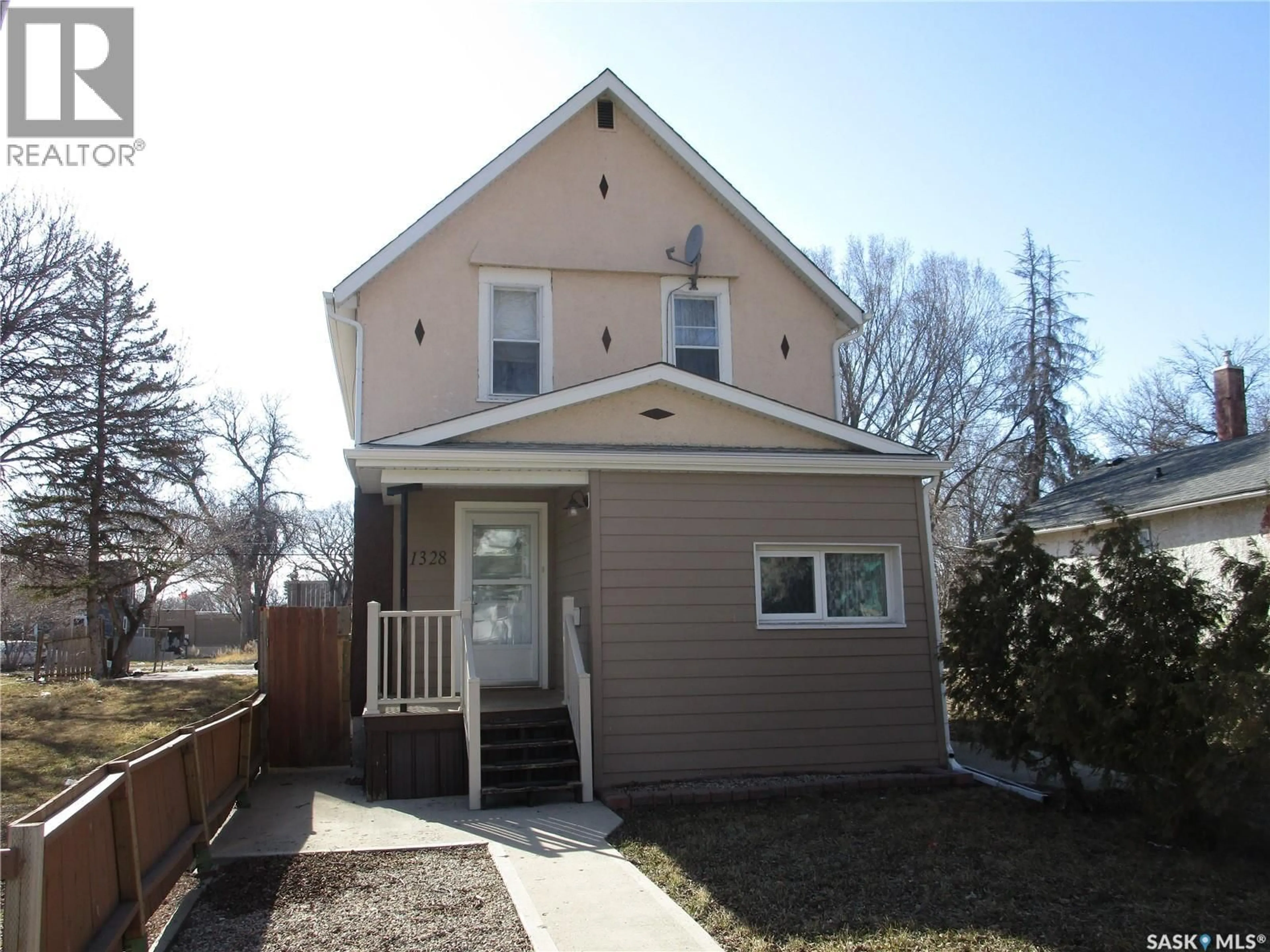 Home with vinyl exterior material, street for 1328 RETALLACK STREET, Regina Saskatchewan S4T2H9