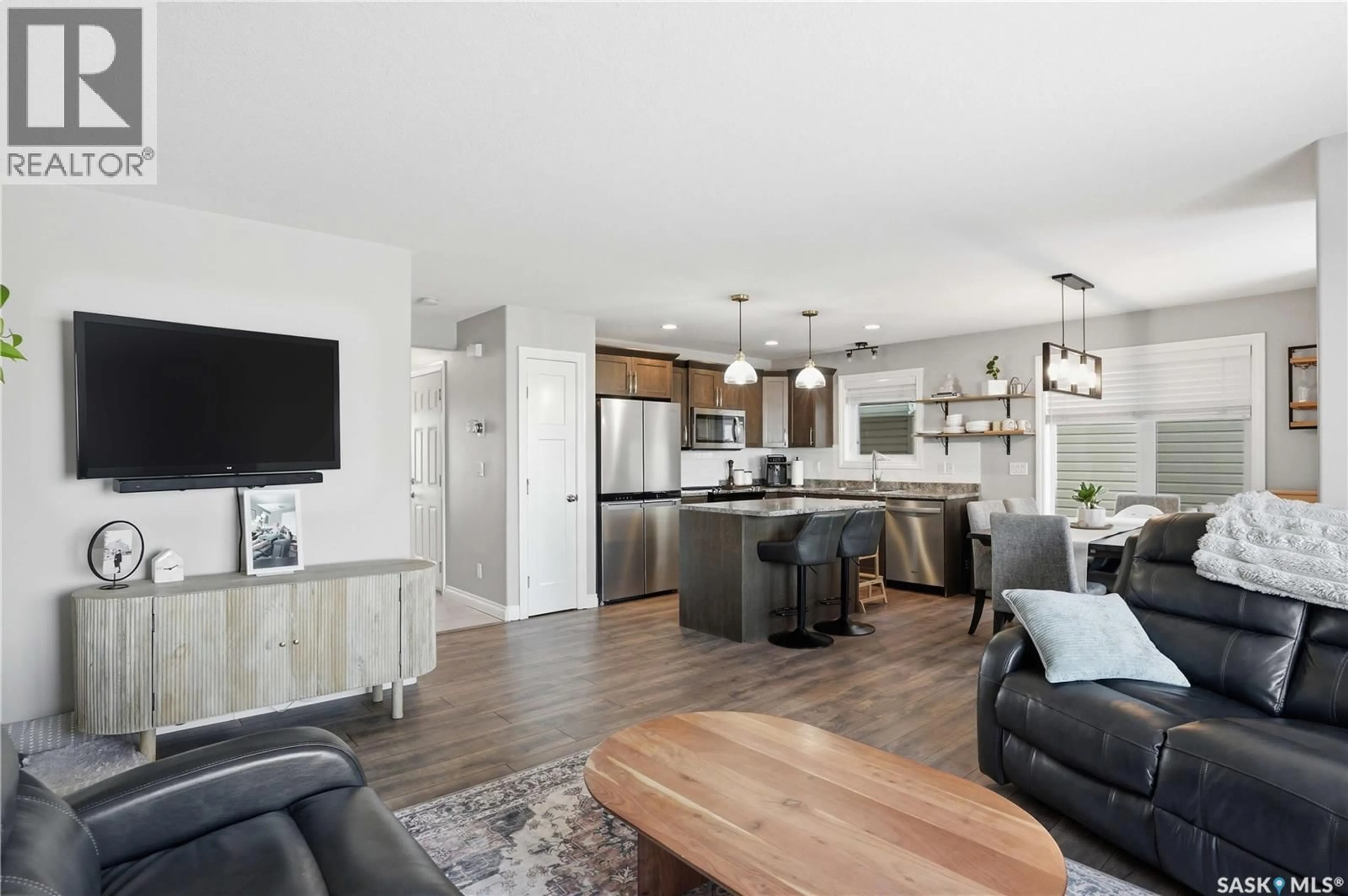 Open concept kitchen, wood/laminate floor for 259 HENICK CRESCENT, Saskatoon Saskatchewan S7R0J5