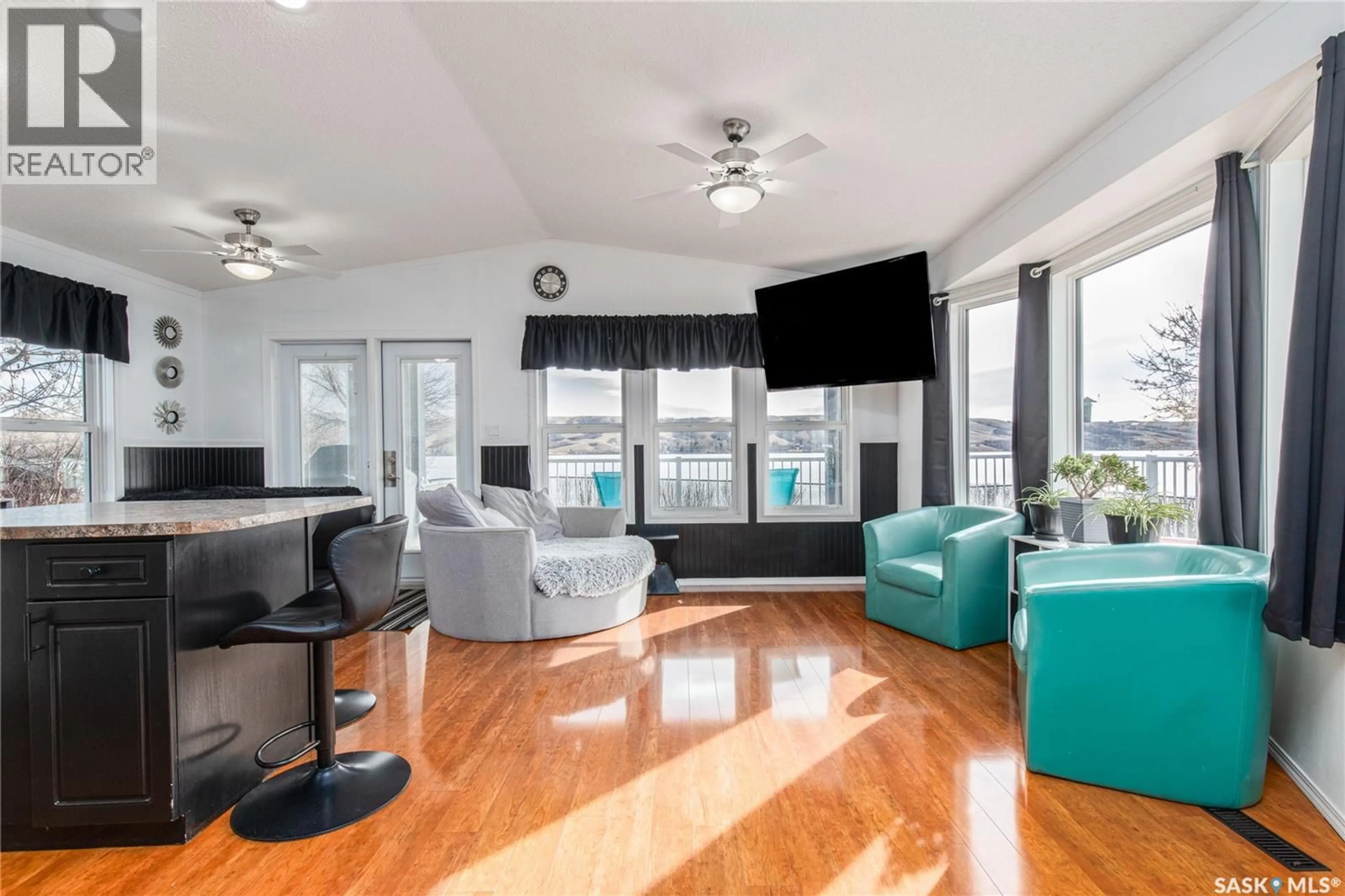 Living room with furniture, wood/laminate floor for 130 MARINE DRIVE, South Lake Saskatchewan S0G4C0