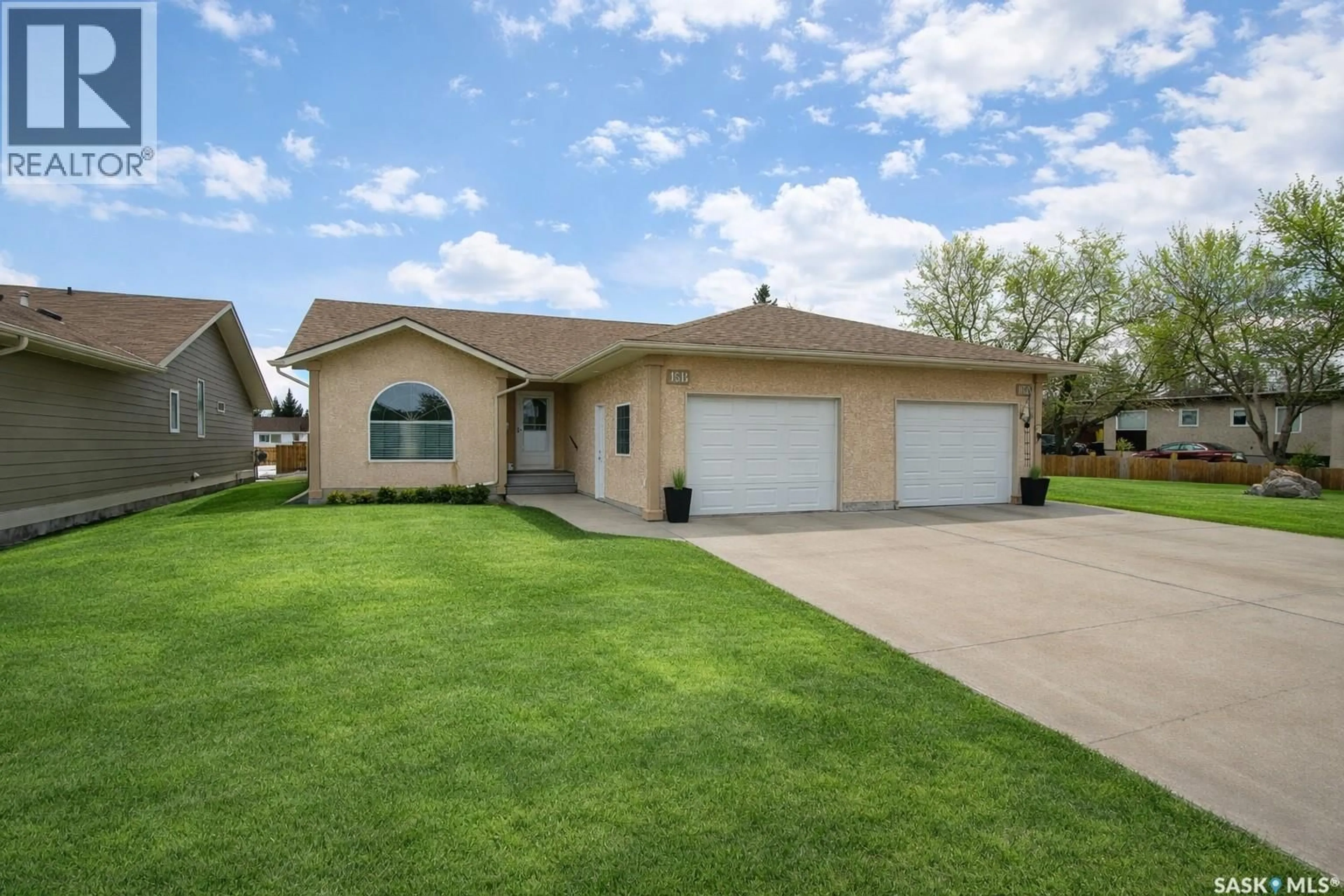 Home with vinyl exterior material, street for 15B DOWNING DRIVE, Lanigan Saskatchewan S0K2M0