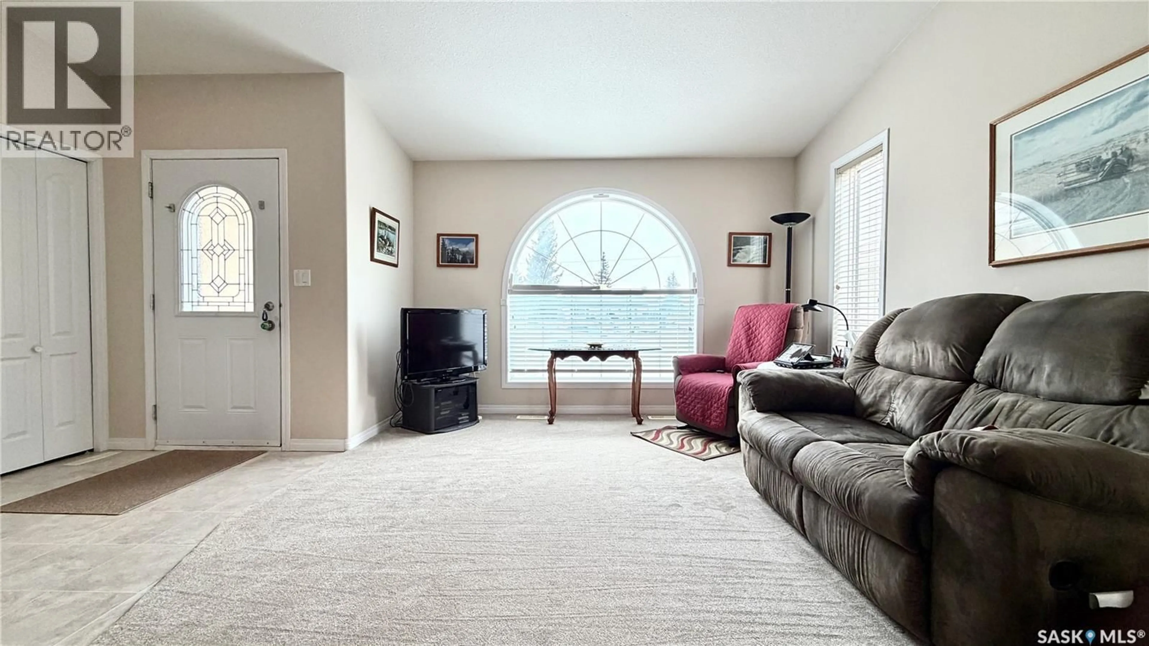 Living room with furniture, carpet floor for 15B DOWNING DRIVE, Lanigan Saskatchewan S0K2M0