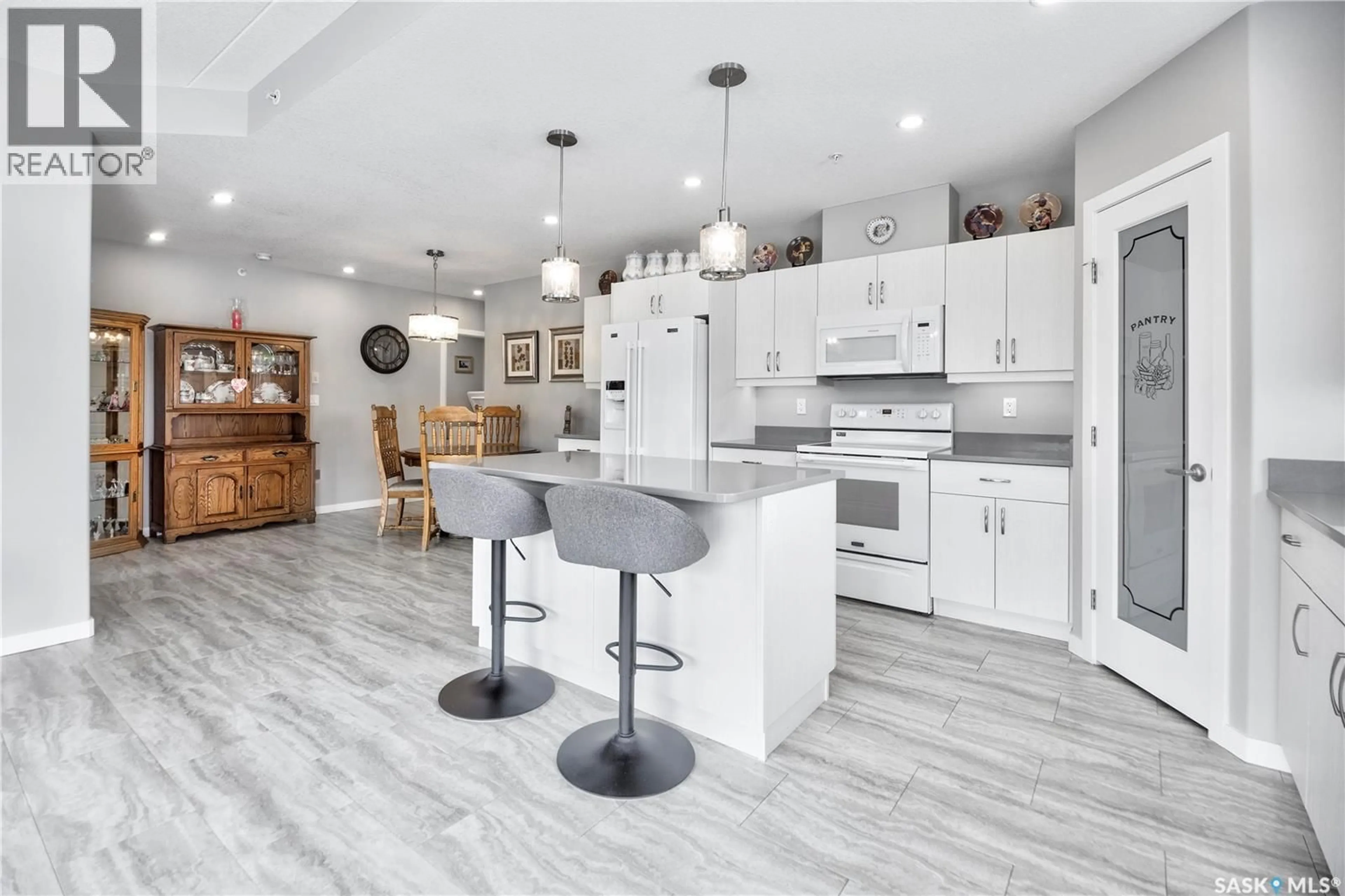 Open concept kitchen, ceramic/tile floor for 204 - 2641 WOODBRIDGE DRIVE, Prince Albert Saskatchewan S6W0A9