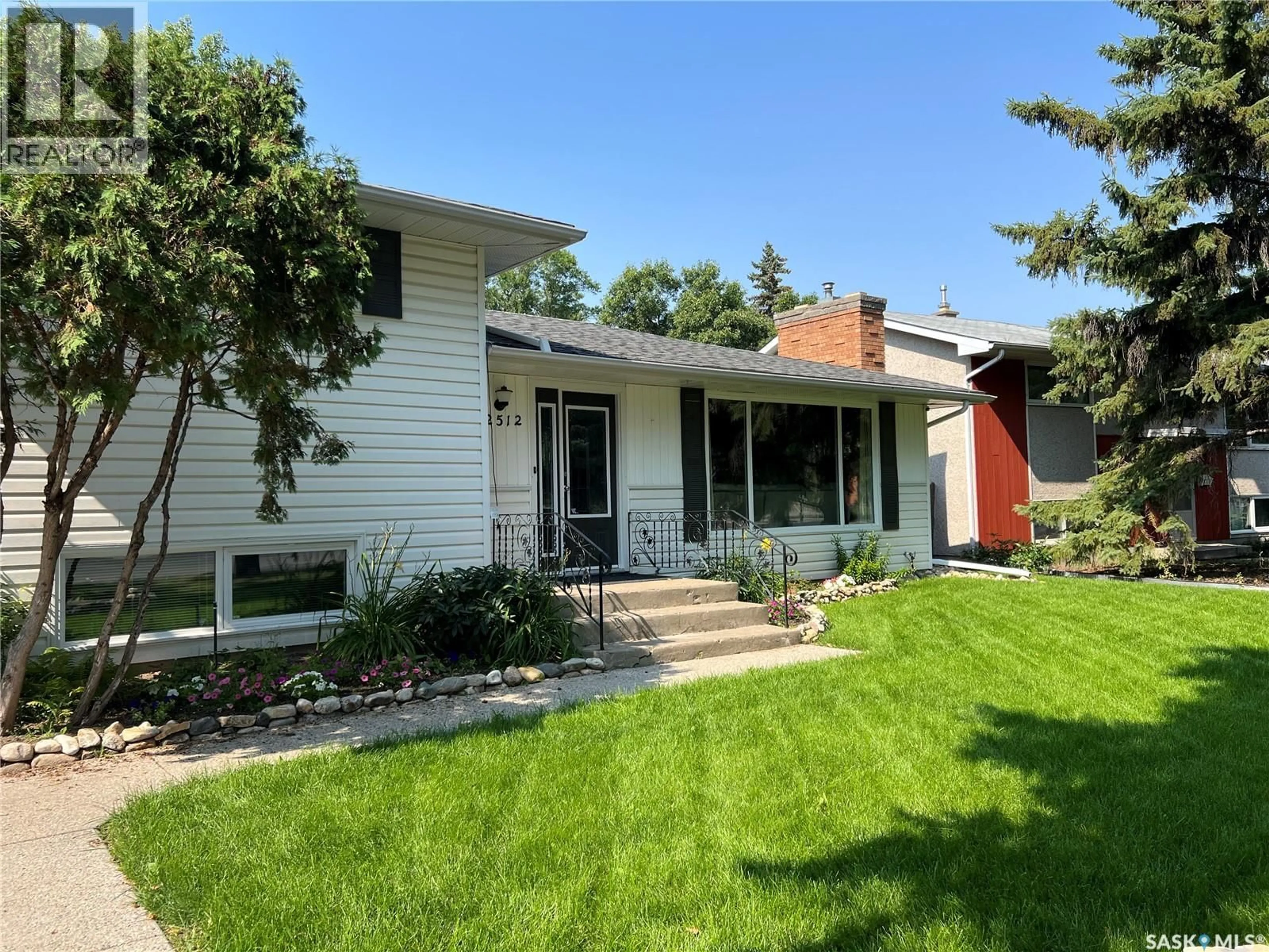 Home with vinyl exterior material, street for 2512 GRANT ROAD, Regina Saskatchewan S4S5E6