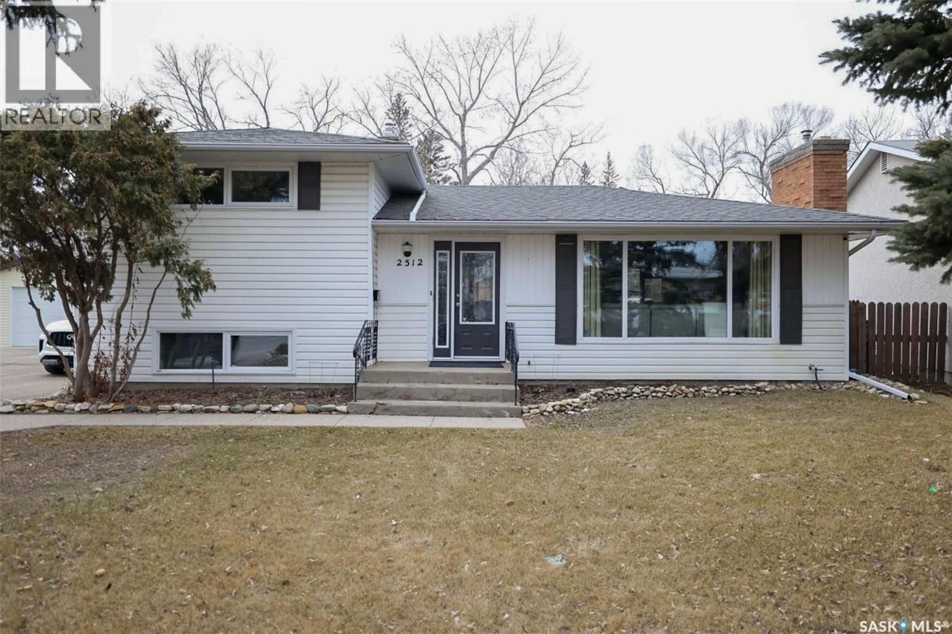 Home with vinyl exterior material, street for 2512 GRANT ROAD, Regina Saskatchewan S4S5E6